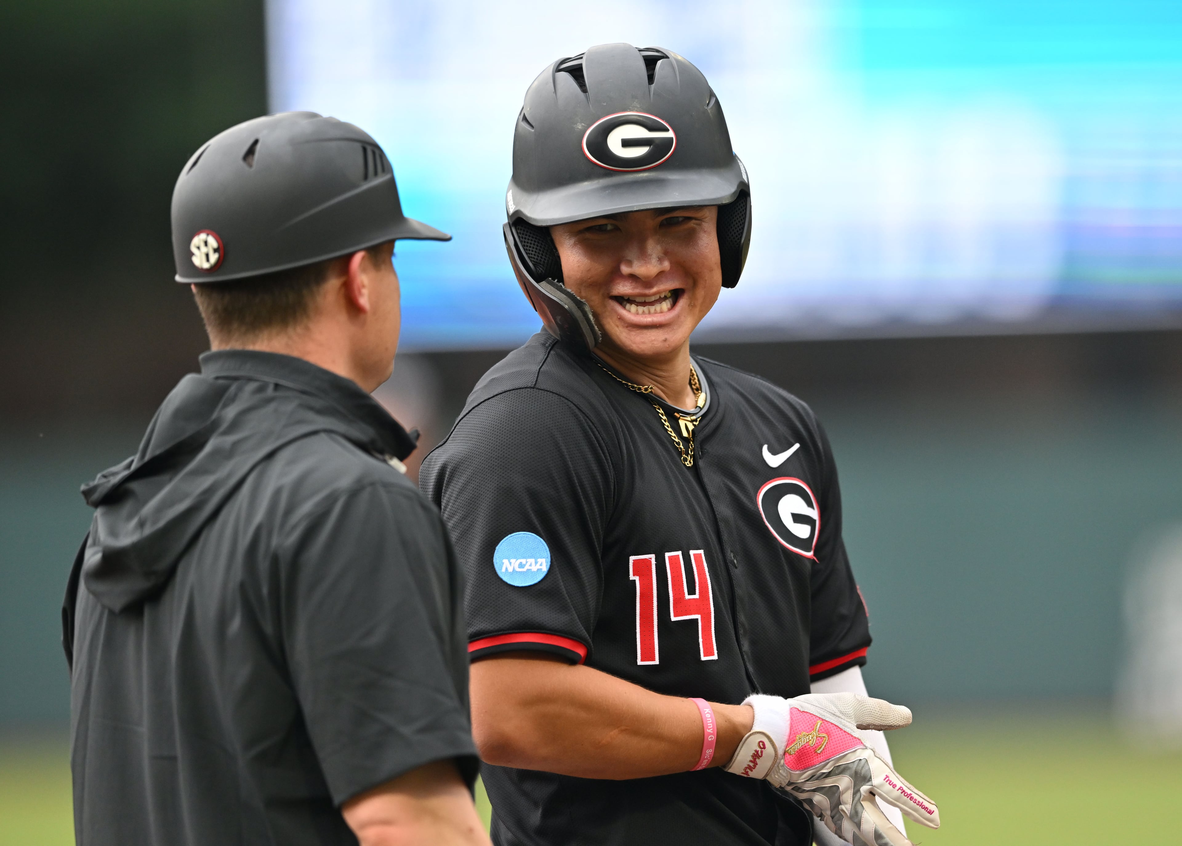 Georgia Kenny Ishikawa (14) reacts after hitting a single, but advances to third base on a throwing error during the third inning of their NCAA Regional game at Foley Field, Friday, May 29, 2026, in Athens. (Hyosub Shin/AJC)