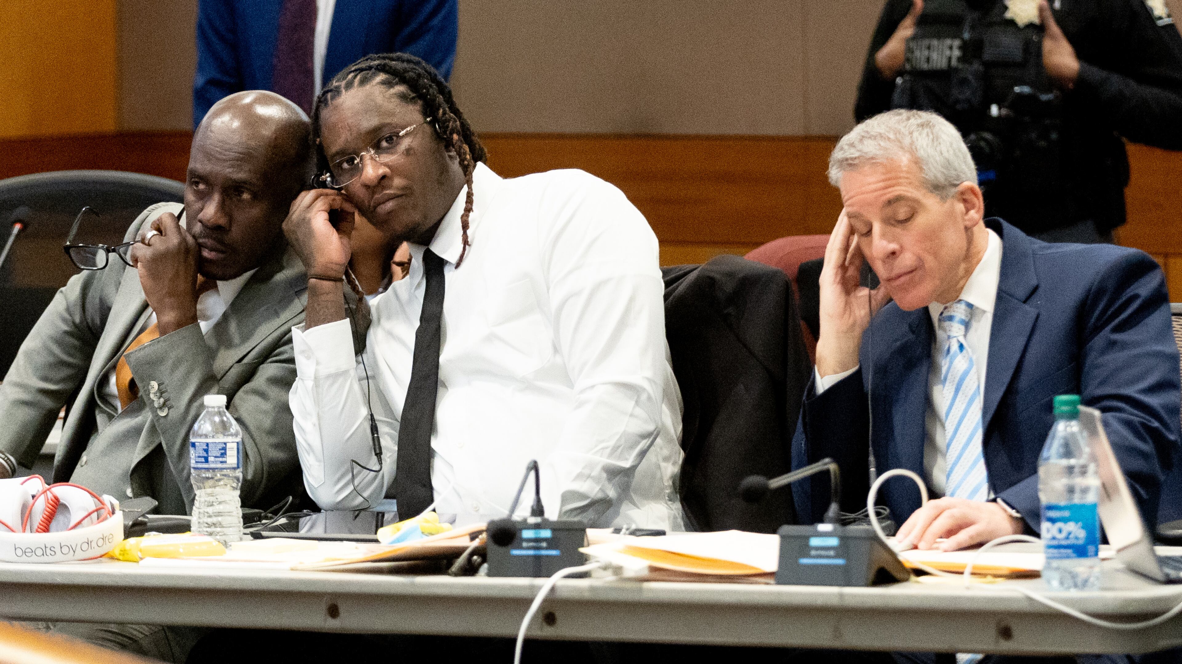 Atlanta rapper Young Thug listens in on a bench meeting between the judge and another attorney before the opening statements in his Fulton County gang and racketeering trial on Monday, Nov. 27, 2023. (Steve Schaefer/steve.schaefer@ajc.com)
