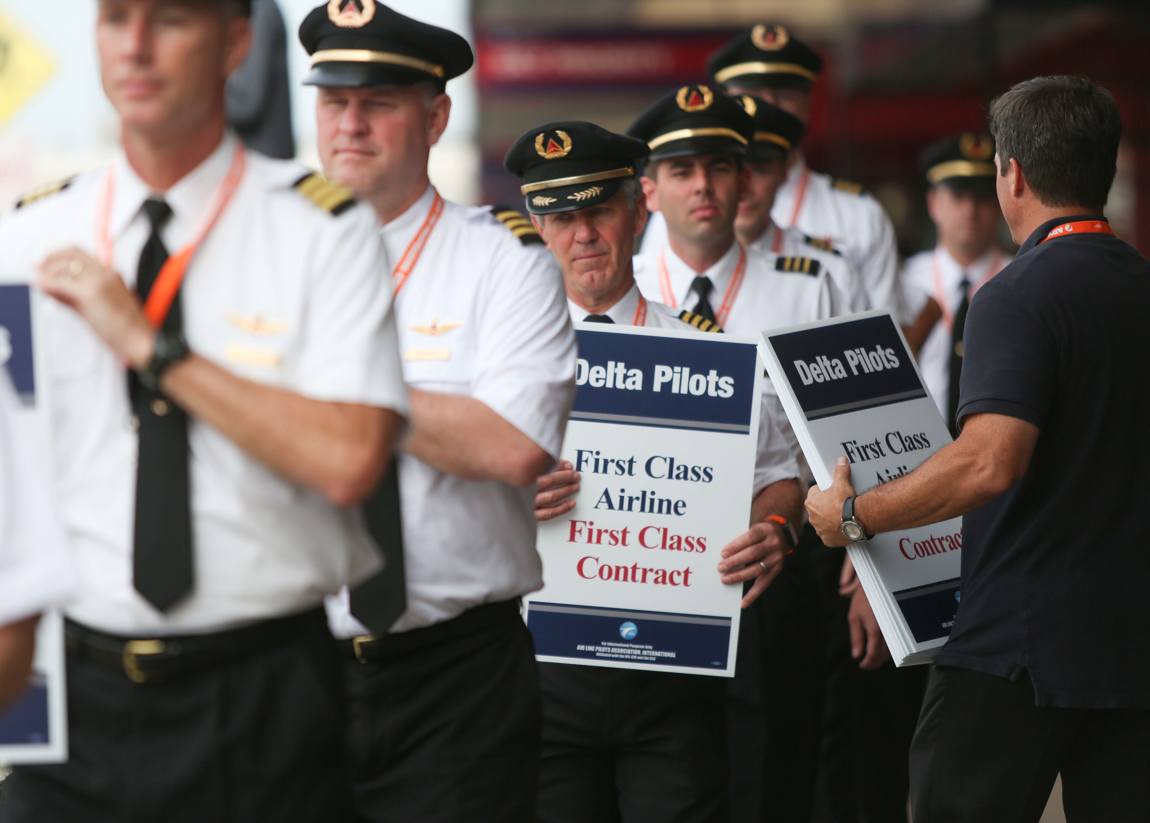 June 24, 2016 Atlanta: Delta pilots conduct informational picketing at the south terminal at Hartsfield-Jackson Atlanta International Airport on Friday morning. Delta pilots are raising awareness and urgency with Delta management for higher pay in negotiations for a new labor contract. "We are almost six months overdue for a new labor contract," said Master Executive Council (MEC) Chairman of Delta Airlines, John Malone, who has worked at Delta Airlines for 28 years. Delta pilots around the country also participated on Friday morning. EMILY JENKINS/ EJENKINS@AJC.COM
