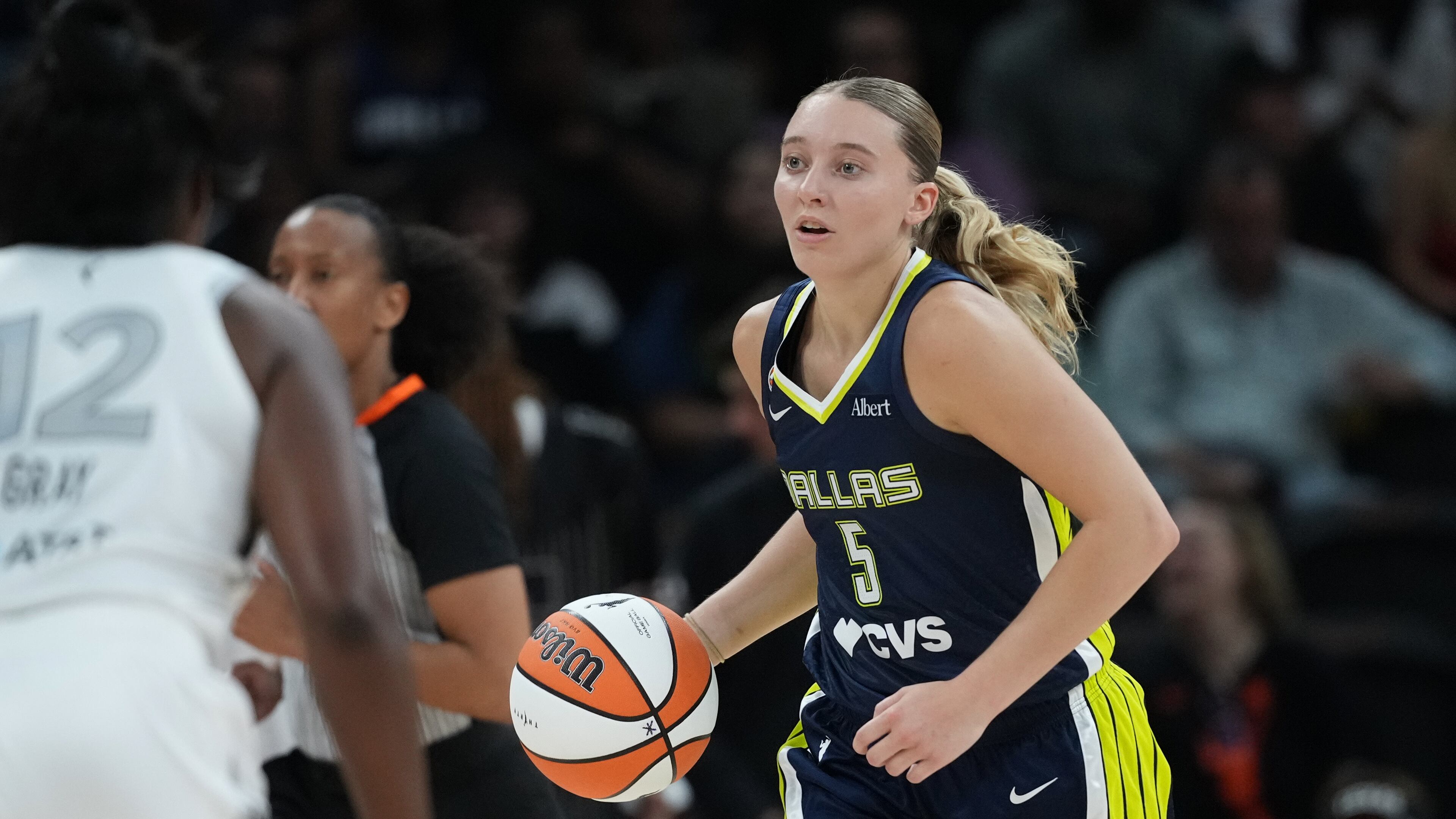 Dallas Wings guard Paige Bueckers (5) moves the ball up court against the Las Vegas Aces during the second half of a WNBA preseason basketball game in Austin, Texas, Sunday, May 3, 2026. (AP Photo/Eric Gay)