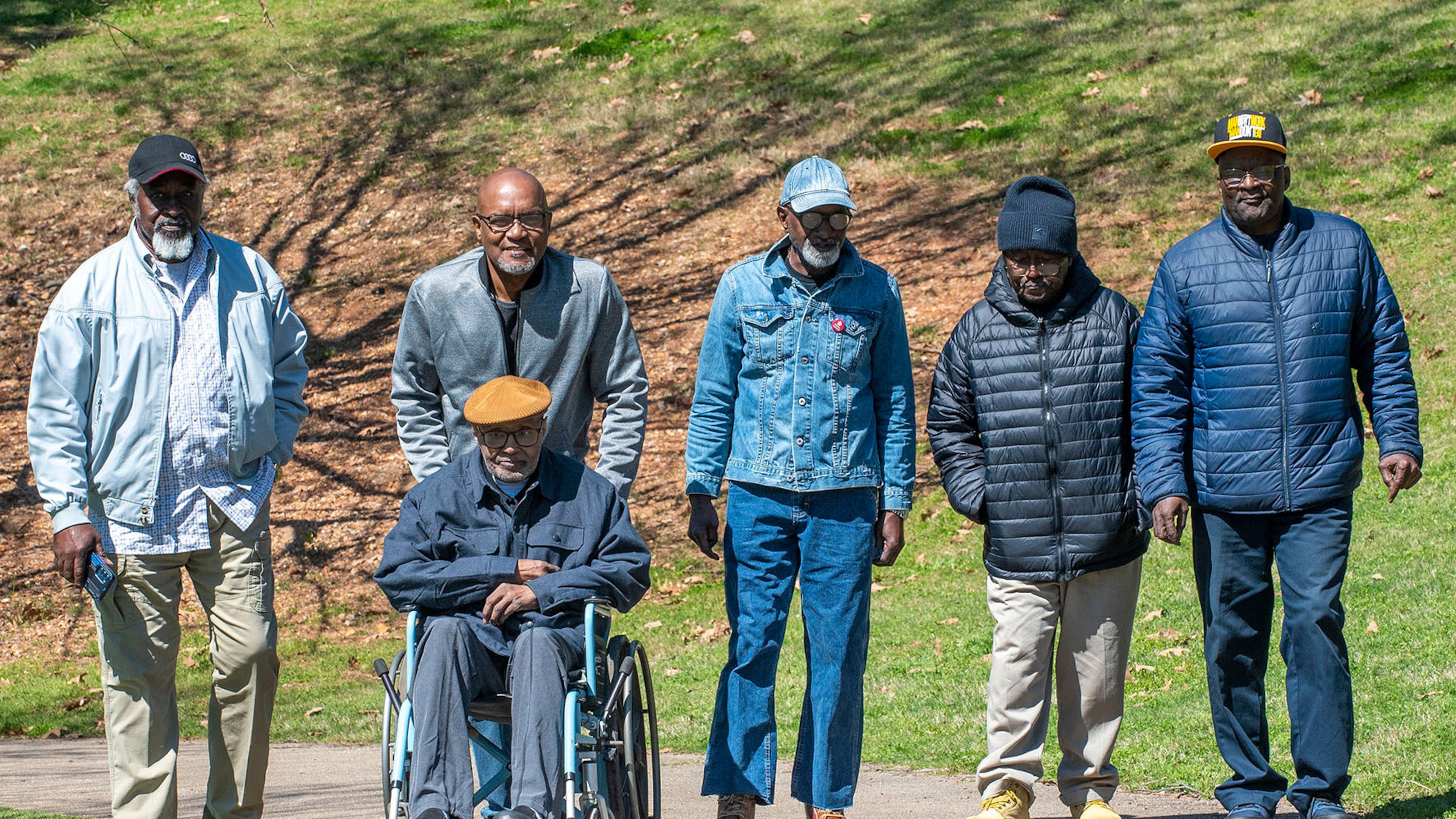 This 2023 photo provided by the Alabama Appleseed Center for Law and Justice shows Larry Garrett, Ronald McKeithen, Robert Cheeks, Lee Davis, John Coleman and Willie Ingram, all of whom served decades in life sentences without parole in Alabama prisons, walking through a park in Birmingham, Ala. (Bernard Troncale/Alabama Appleseed Center for Law and Justice via AP)
