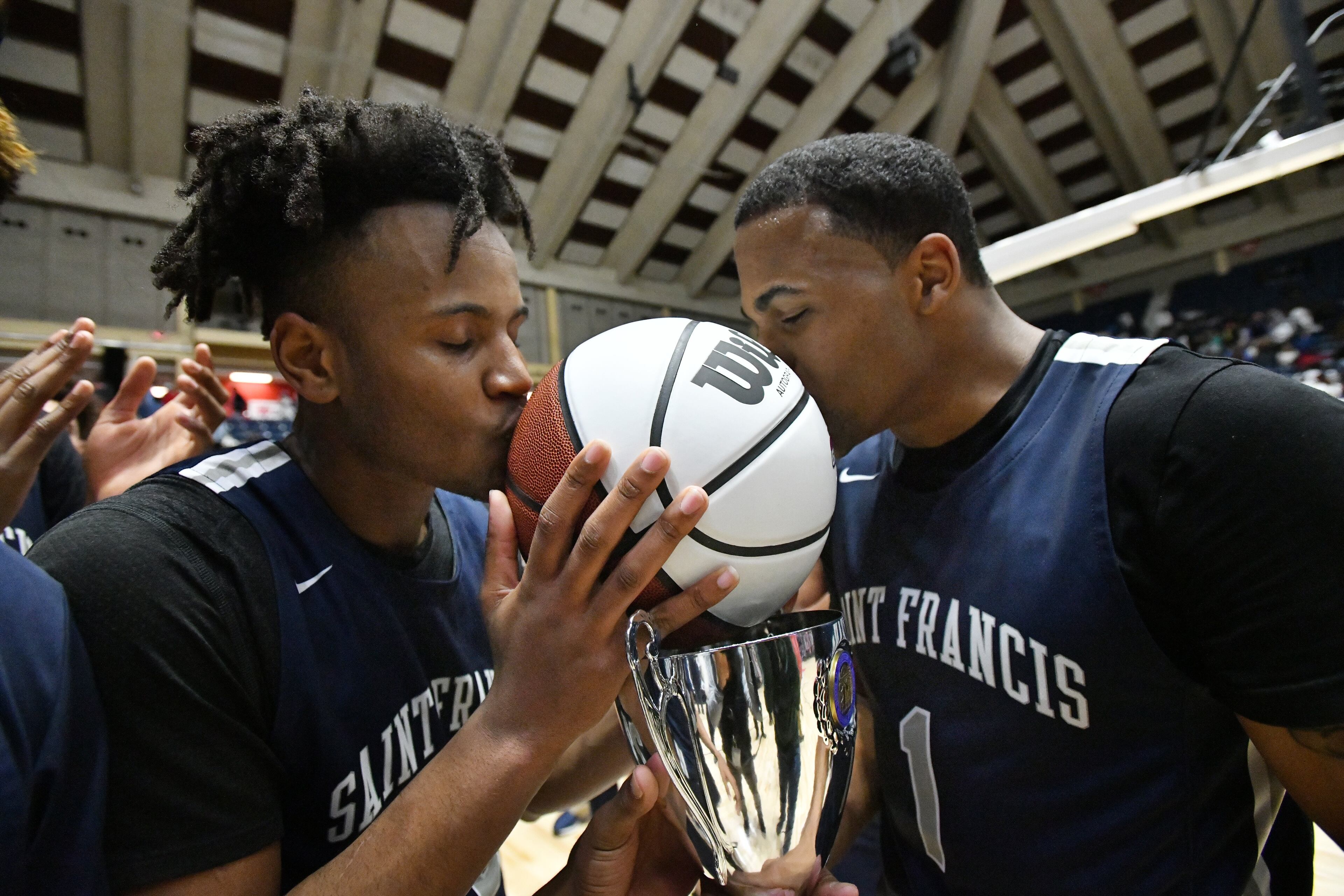 St. Francis' Jordan Brown (left) and Dwon Odom (right) celebrate their victory over Greenforest. (Hyosub Shin / Hyosub.Shin@ajc.com)