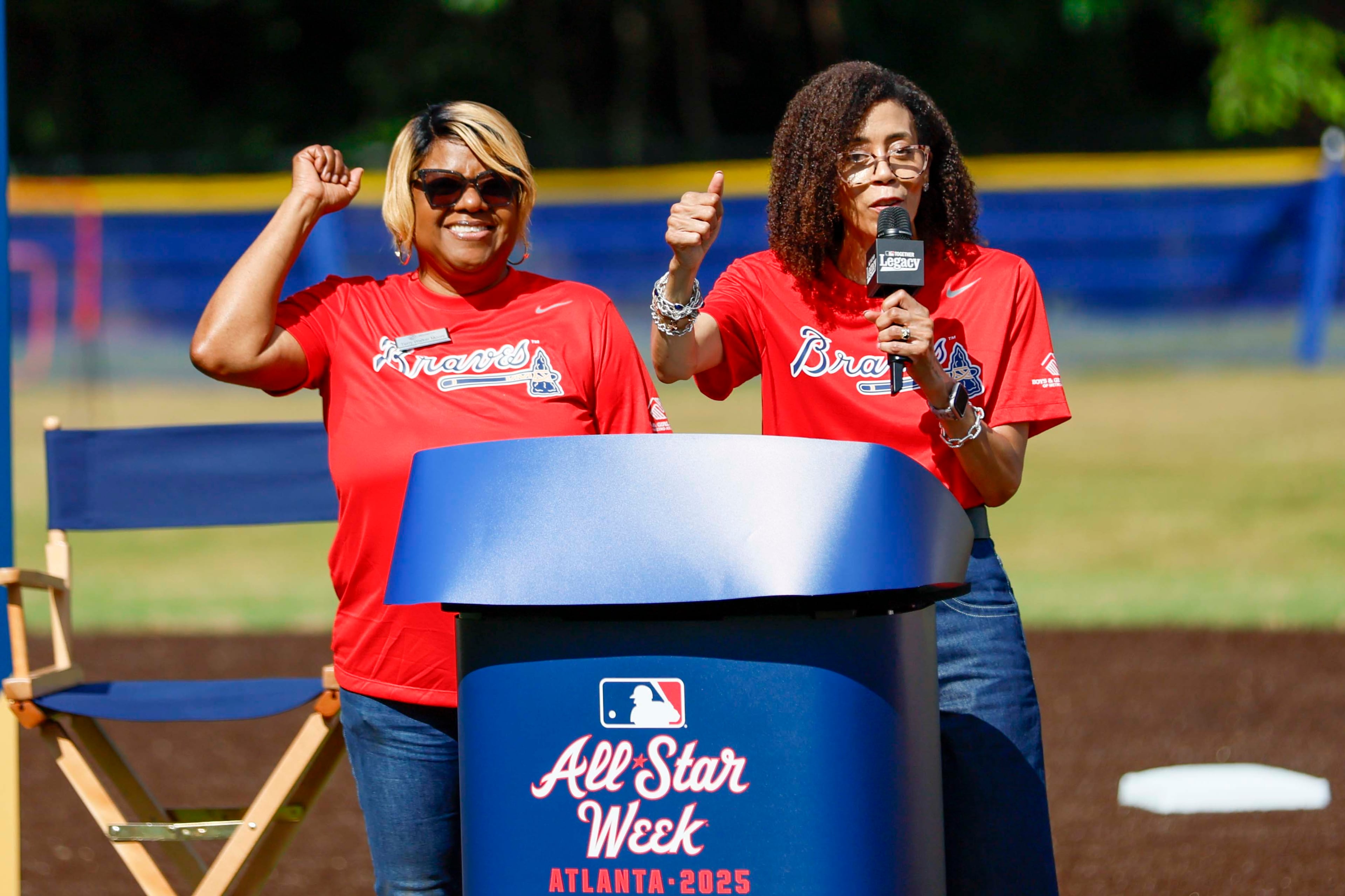 Libby Saylor Wright, CEO of Boys and Girls Club of Metro Atlanta, right, recognizes Terry Walker-Moore, Executive Director, for her 25 years of service during the unveiling of the new All-Star Legacy Field at the Barksdale Boys & Girls Club in Conyers on Thursday, July 10, 2025. The event takes place during the MLB All-Star Game week in Atlanta.
(Miguel Martinez/ AJC)
