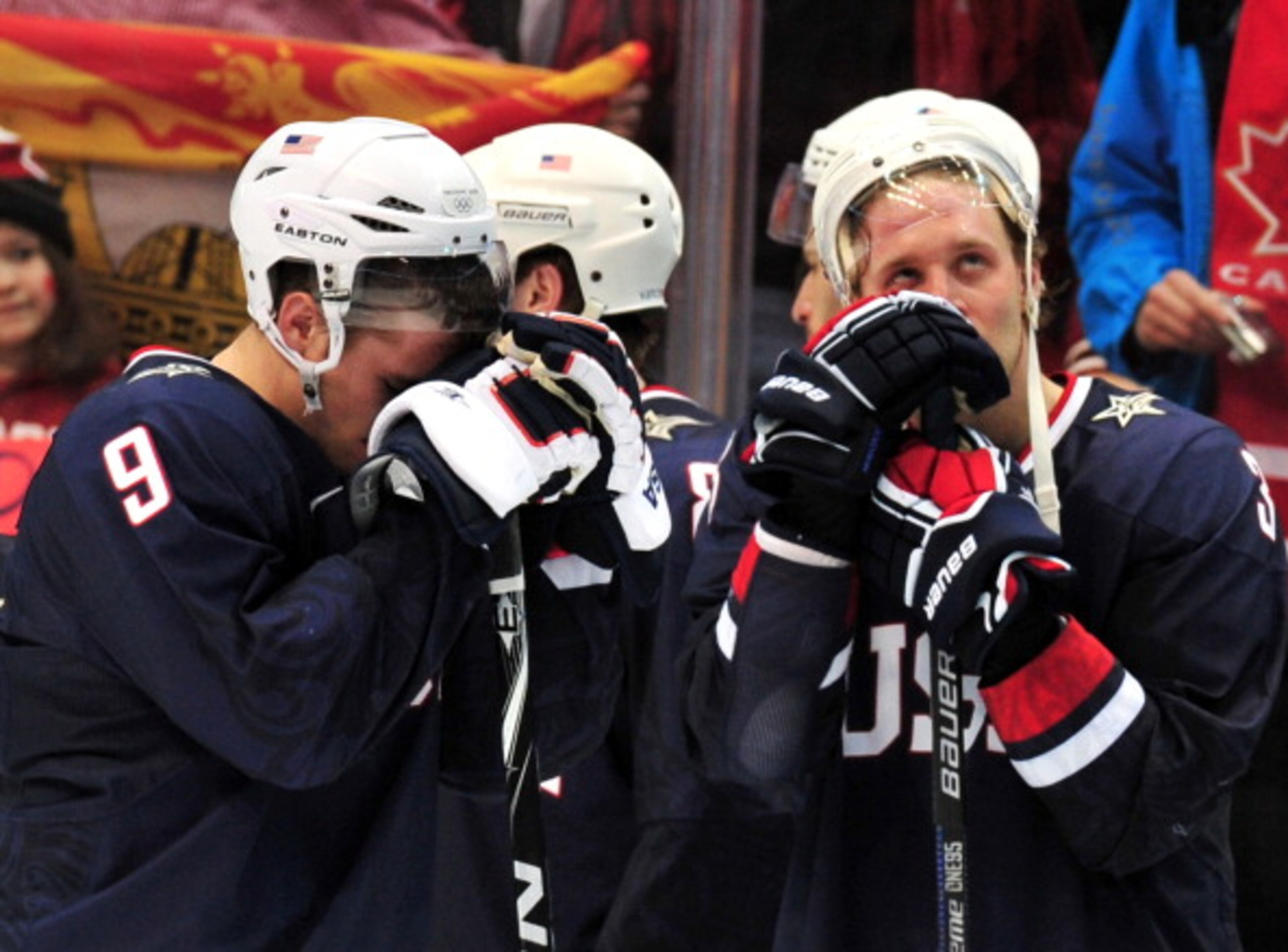 USA's forward Zach Parise (9) and a team mate look dejected following their 2-3 loss to Canada in the Men's Gold Medal Hockey match at the Canada Hockey Place during the XXI Winter Olympic Games in Vancouver, Canada on February 28, 2010. Canada beat the USA 3-2 to win gold. AFP PHOTO / CRIS BOURONCLE (Photo credit should read CRIS BOURONCLE/AFP/Getty Images)