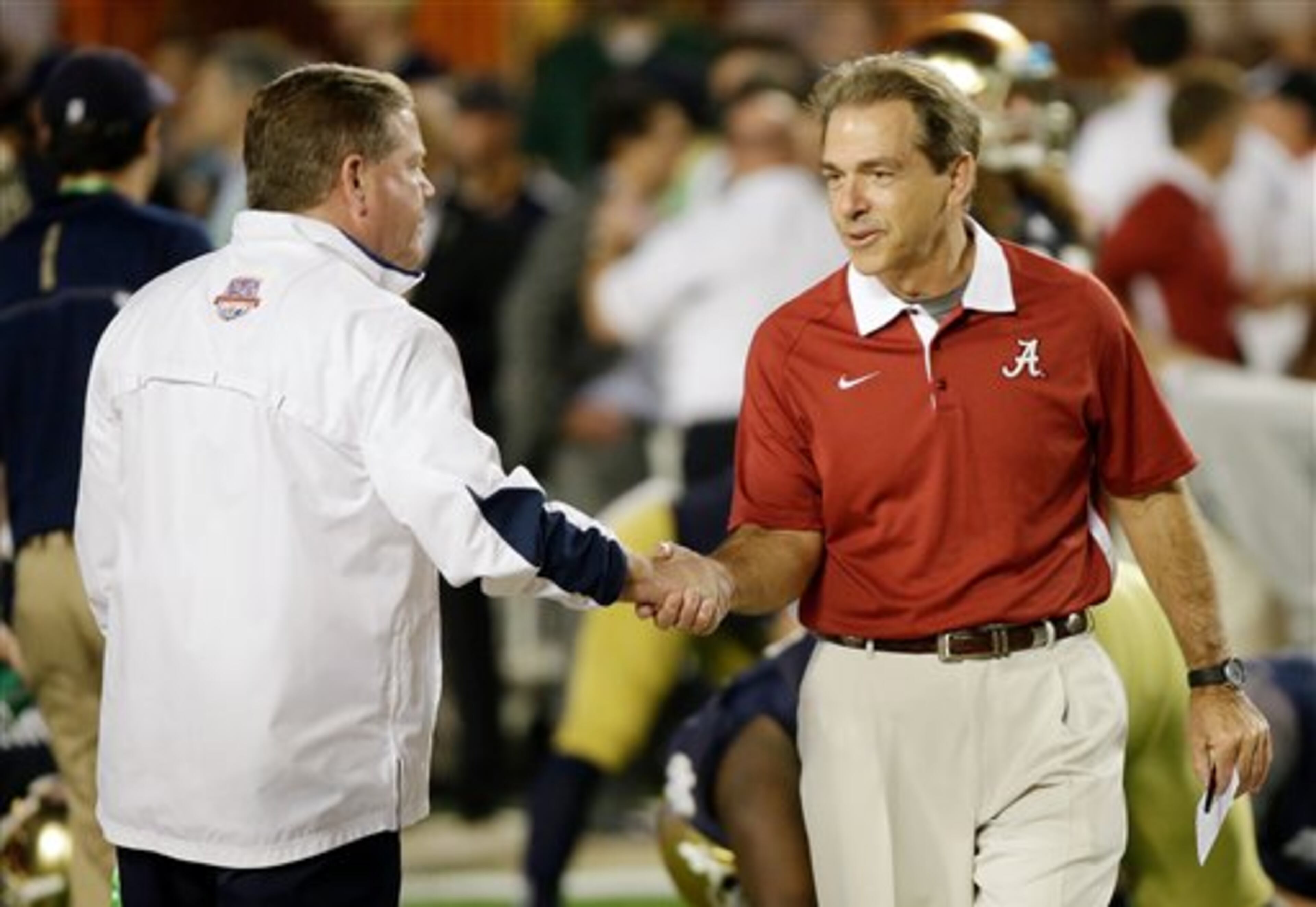 Notre Dame head coach Brian Kelly, left, shakes hands with Alabama head coach Nick Saban before the BCS National Championship college football game Monday, Jan. 7, 2013, in Miami. (AP Photo/David J. Phillip)