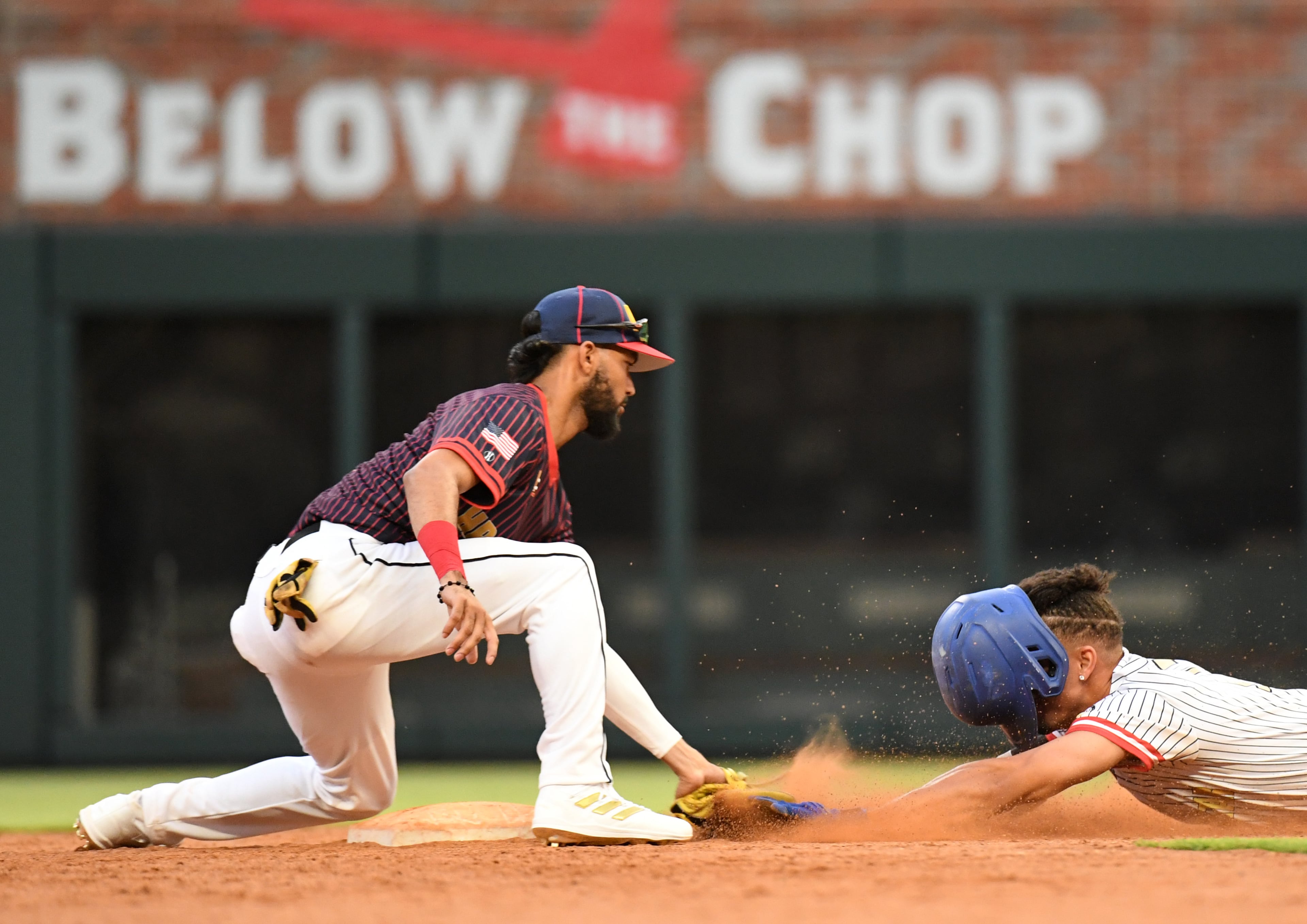 June 3, 2022 Atlanta - HBCU All-Star White team's outfielder Lavoisier Fisher II (17) is tagged out by HBCU All-Star Navy team's Denny Daza (5) in the 3rd inning of the Minority Baseball Prospects HBCU All-Star Game at Truist Park on Friday, June 3, 2022. (Hyosub Shin / Hyosub.Shin@ajc.com)