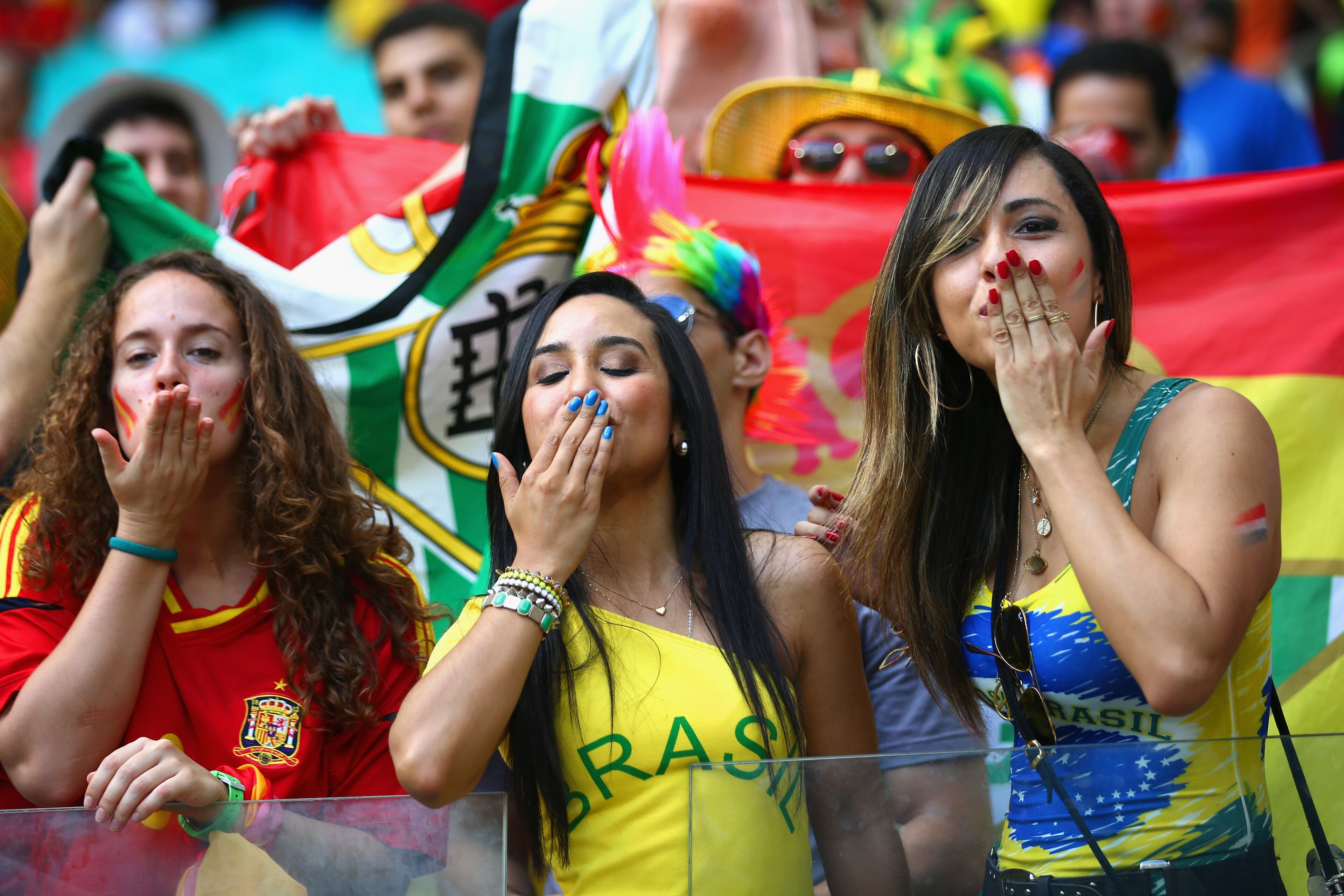 SALVADOR, BRAZIL - JUNE 13: Fans blow kisses before the 2014 FIFA World Cup Brazil Group B match between Spain and Netherlands at Arena Fonte Nova on June 13, 2014 in Salvador, Brazil. (Photo by Ian Walton/Getty Images)