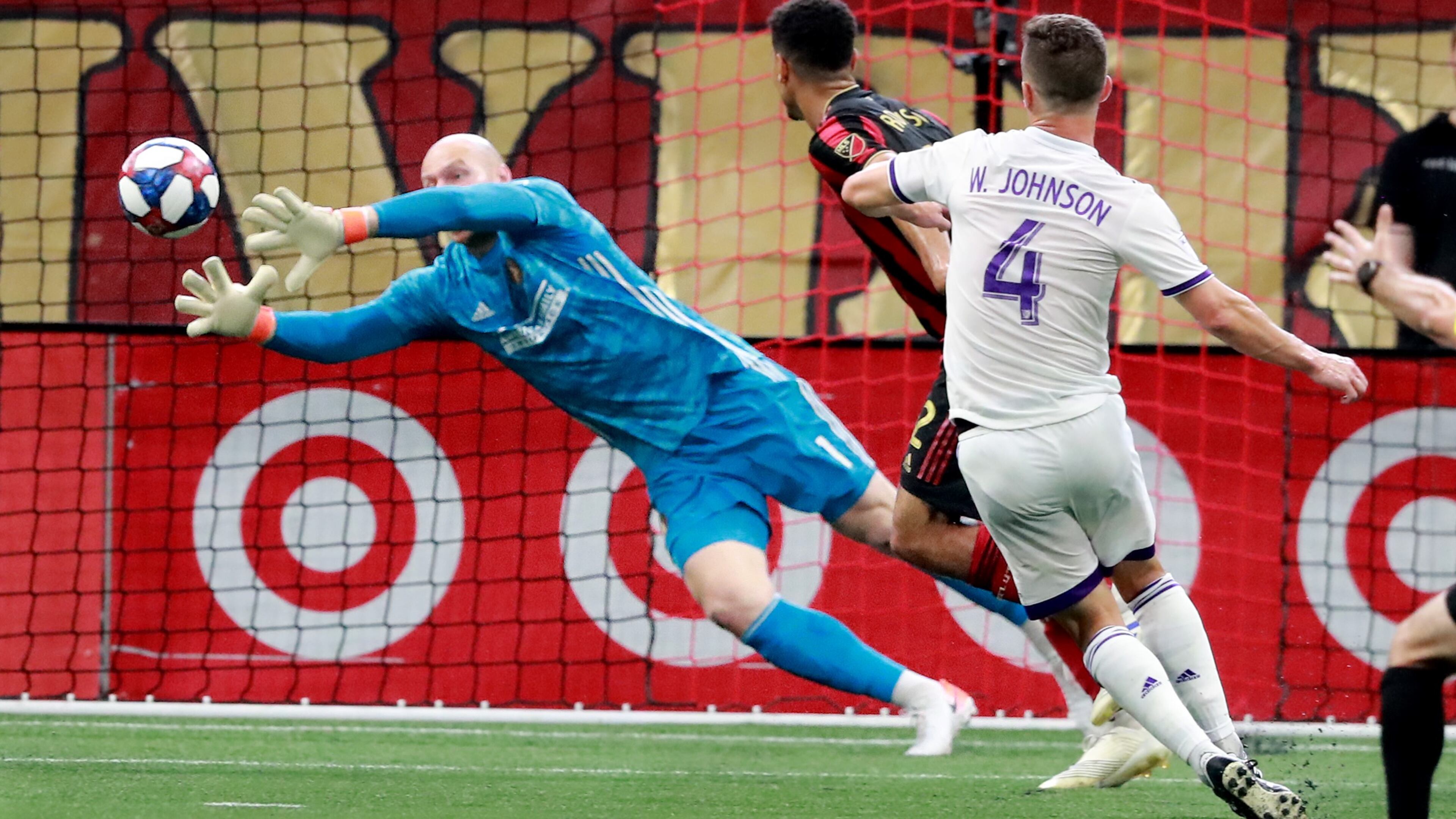 Atlanta United goalkeeper Brad Guzan blocks a shot by Orlando City defender Will Johnson during the first half of a MLS soccer match on Sunday, May 12, 2019, in Atlanta. Atlanta United won the game 1-0. Curtis Compton/ccompton@ajc.com