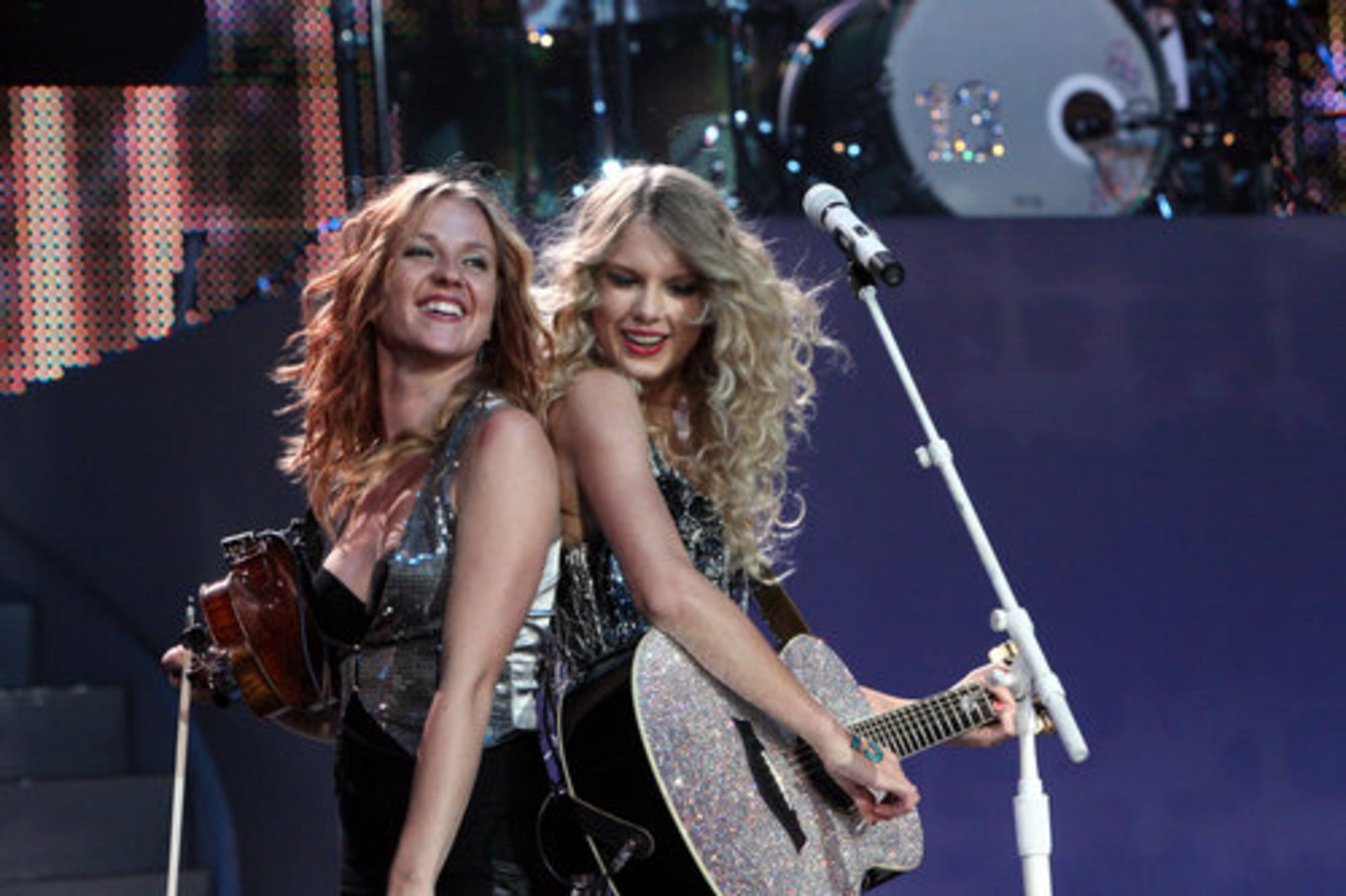 The Pennsylvania native (right, seen here with a musician) is famous for her rise to fame through her songwriting ability and her dogged ambition.
