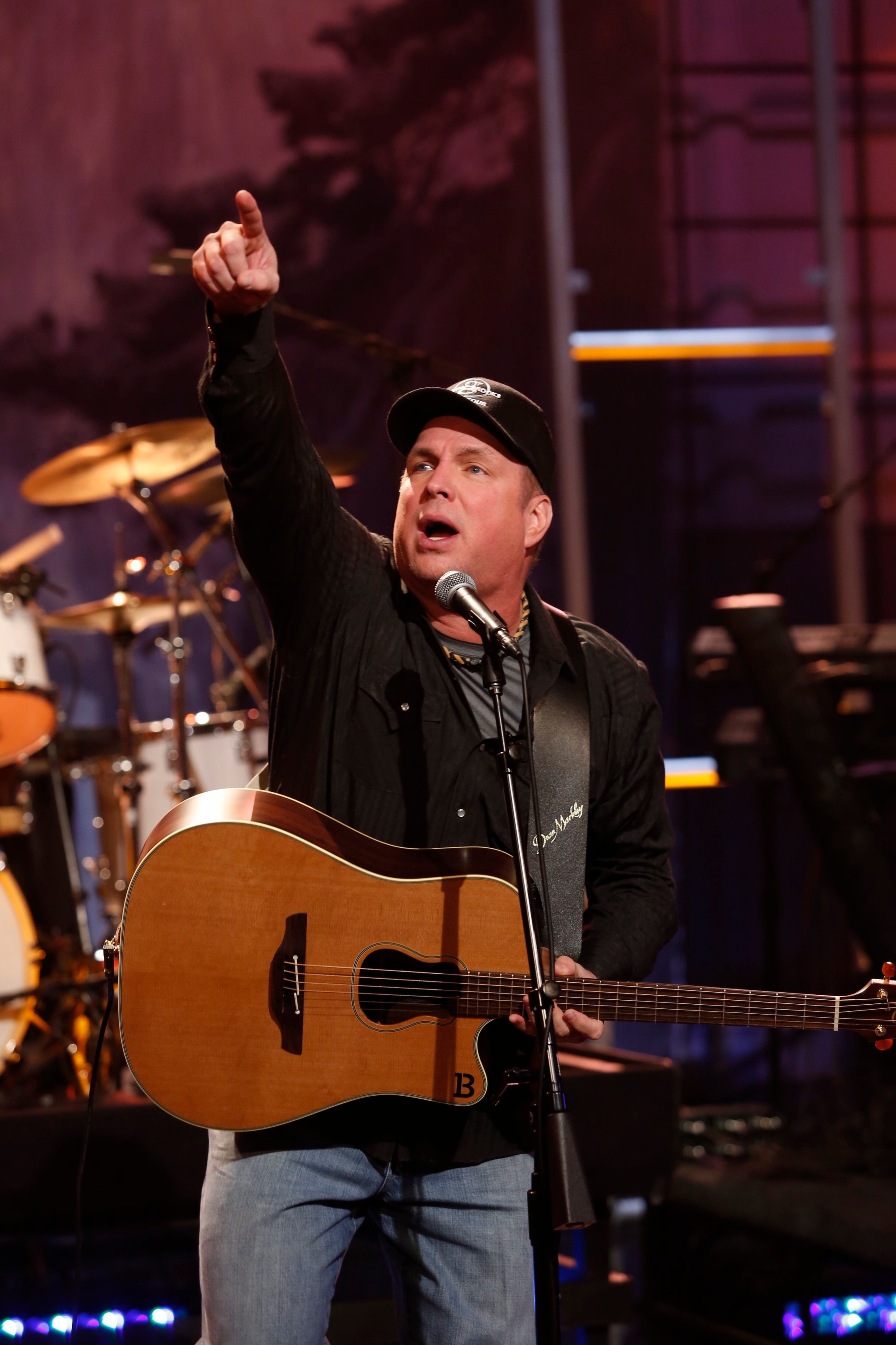 In this photo provided by NBC, musical guest Garth Brooks performs during Jay Leno's final episode of "The Tonight Show," Thursday, Feb. 6, 2014, in Burbank, Calif. (AP Photo/NBC, Stacie McChesney)
