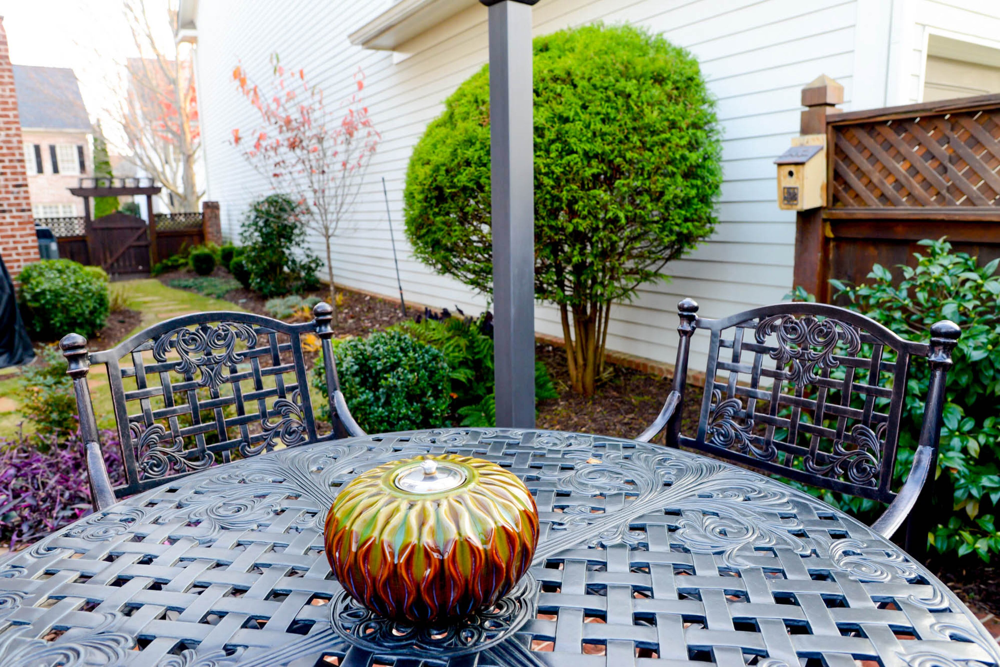 The cluster home in the Palisades at Milton Park has a courtyard-style backyard, where the homeowners can dine al fresco.