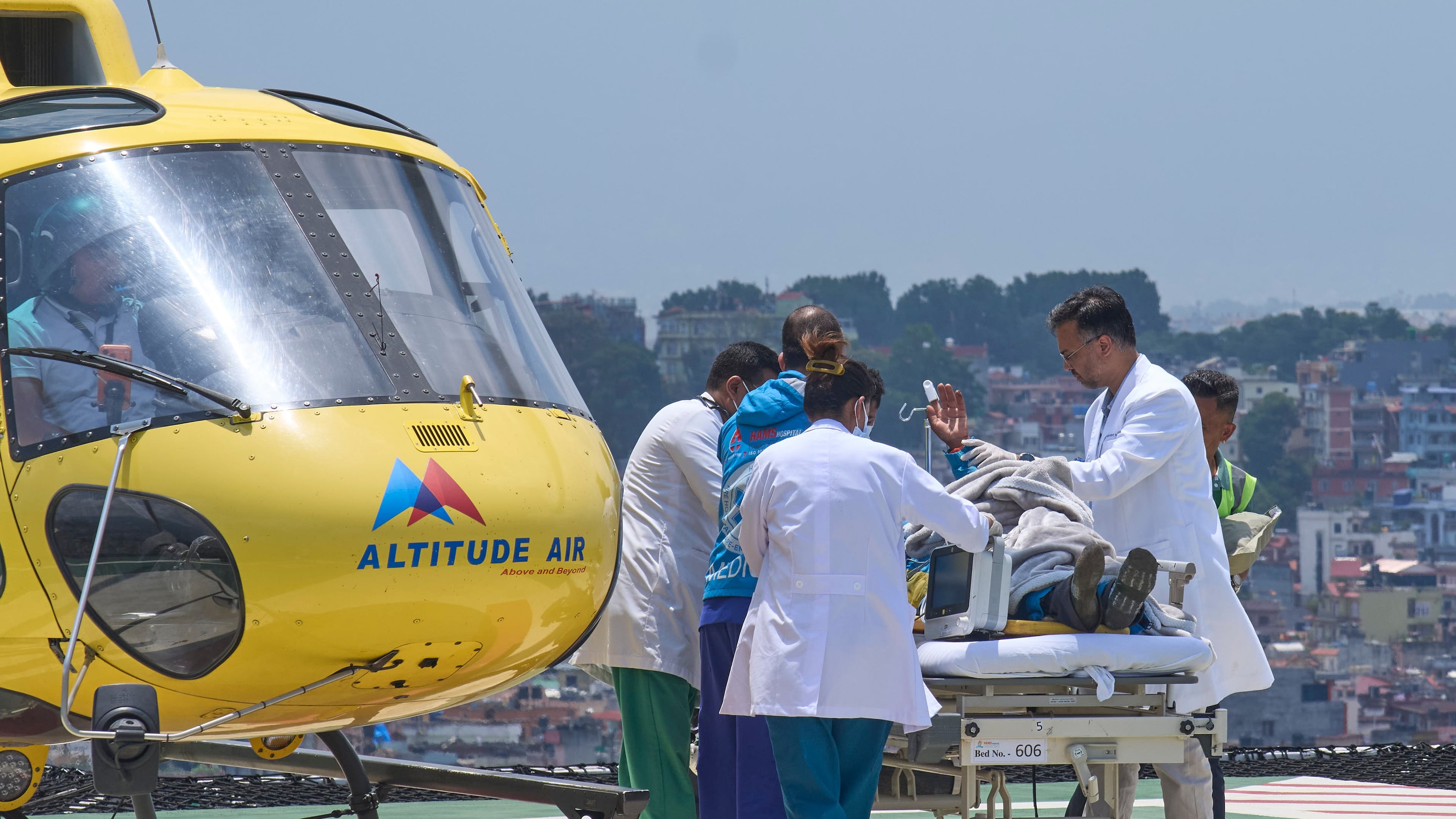 Medics take Dawa Sherpa, a mountain guide who had been missing for several days in the Everest region, for treatment after he arrived at Grande Hospital in Kathmandu, Nepal, Thursday, June 4, 2026. (AP Photo/Niranjan Shrestha)