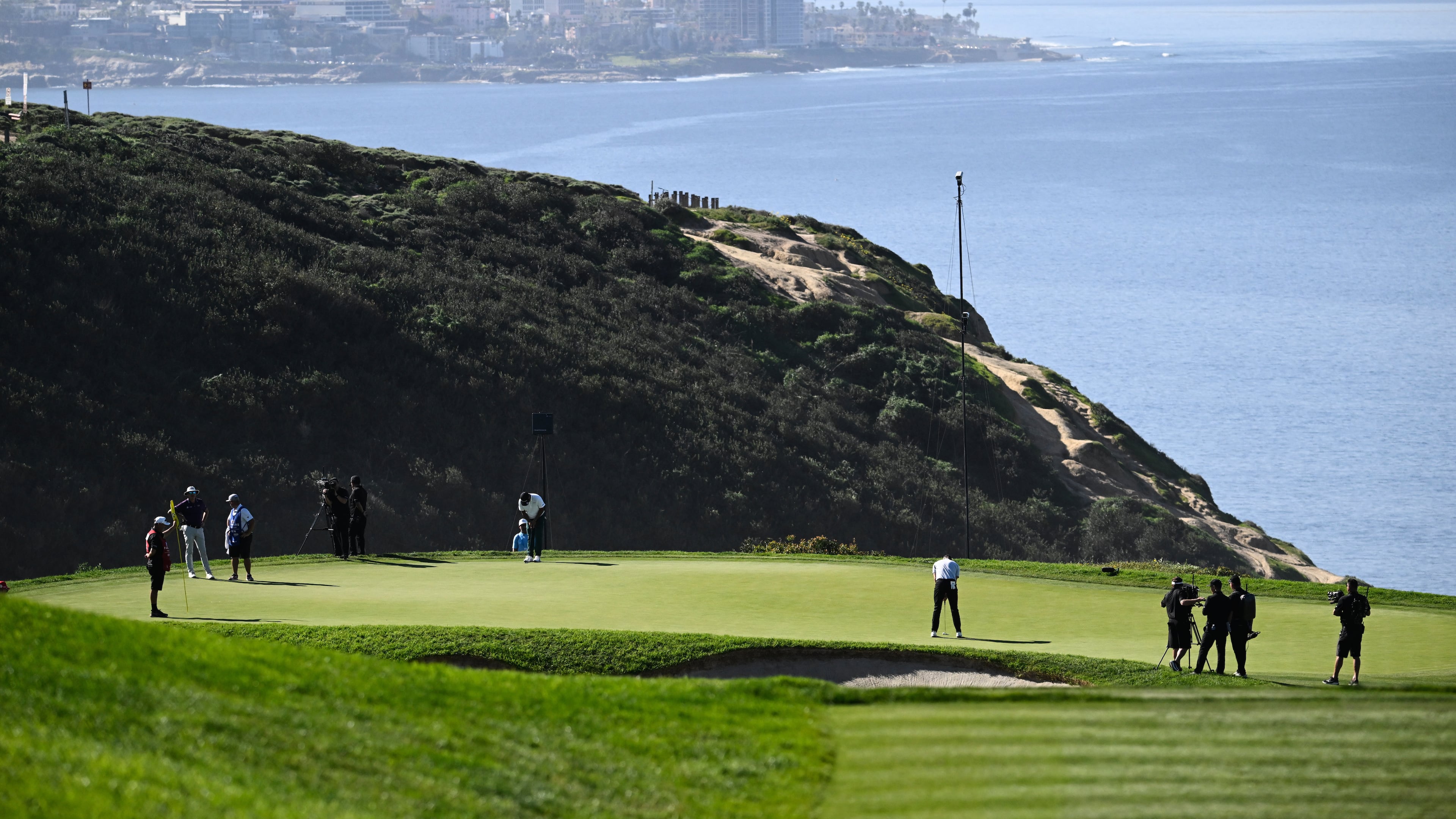 FILE - Justin Rose, of England, putts on the third green of the South Course at Torrey Pines during the final round of the Farmers Insurance Open golf tournament, Feb. 1, 2026, in San Diego. (AP Photo/Denis Poroy, file)