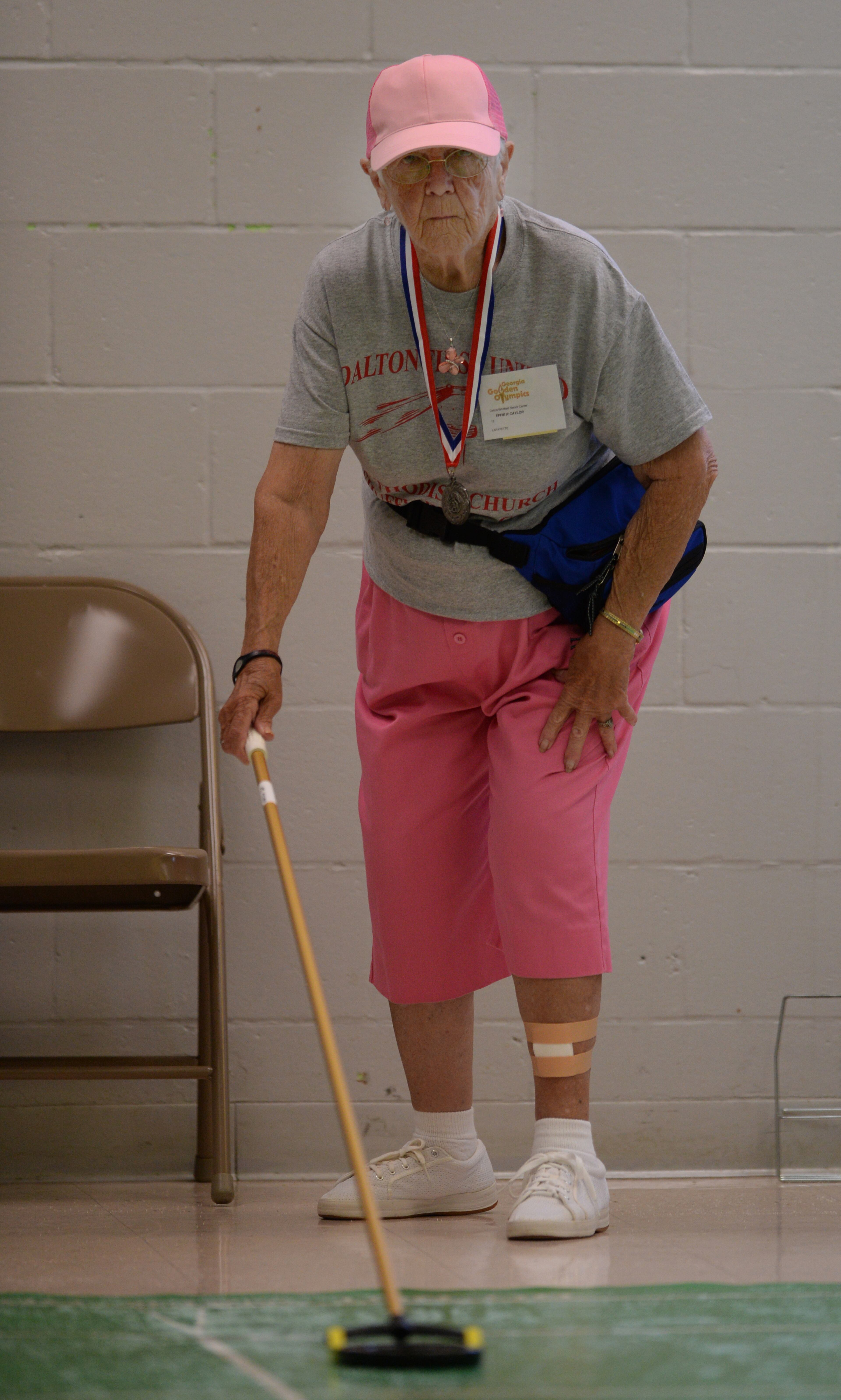 Effie Claytor, 88, Dalton, Georgia, competes in shuffleboard during the Thirty - First Annual Georgia Golden Olympics in Warner Robins, Georgia on Thursday, September 19, 2013. She won a gold medal. Over 430 seniors from age 50 to 92 competed in track & field, swimming, horse shoes, bowling, cycling, checkers, wheelchair, billiards, tennis, and archery. The games started on September 18, 2013 and end on September 21, 2013.