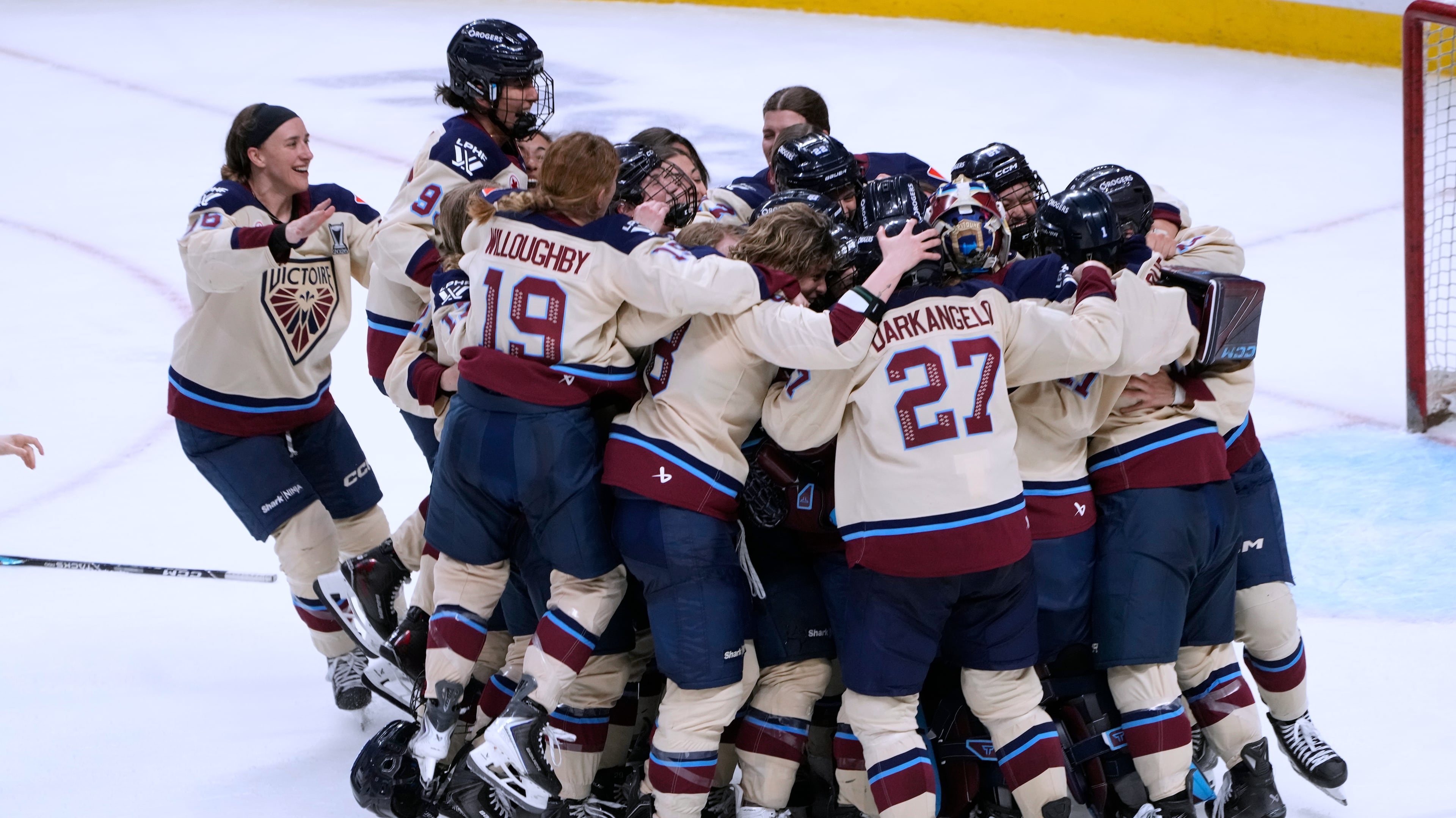 Montreal Victoire players celebrate after defeating the Ottawa Charge to win the PWHL Walter Cup hockey final in Ottawa, Wednesday May 20, 2026. (Adrian Wyld/The Canadian Press via AP)
