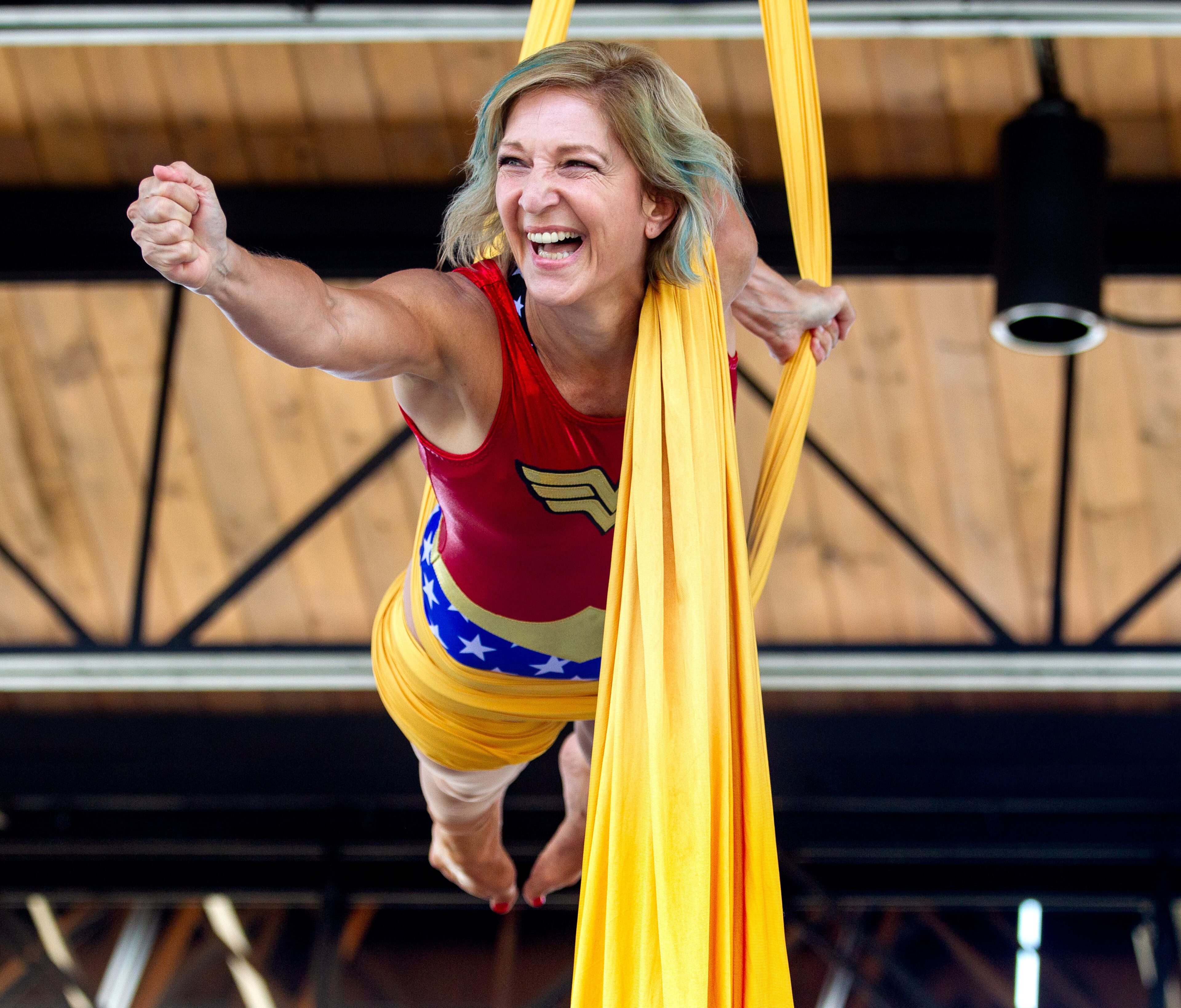 Maggie Hudson, dressed as Wonder Woman, performs an aerial silk routine at the Lawrenceville Lawn during the Free Comic Book Day celebration on Saturday, August 14, 2021. STEVE SCHAEFER FOR THE ATLANTA JOURNAL-CONSTITUTION