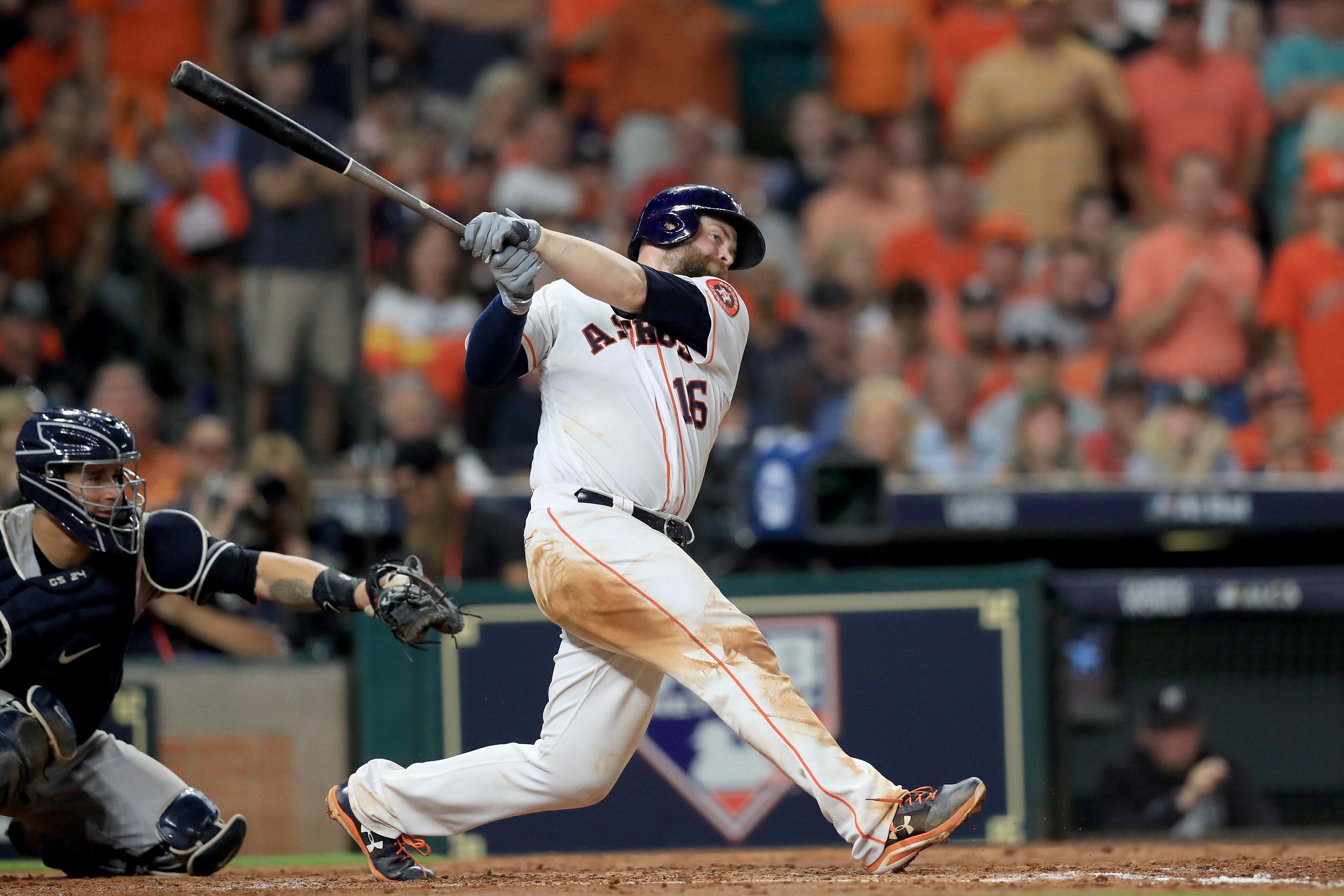 HOUSTON, TX - OCTOBER 21: Brian McCann #16 of the Houston Astros hits a double to right field to score Carlos Correa #1 and Yuli Gurriel #10 against Tommy Kahnle #48 of the New York Yankees during the fifth inning in Game Seven of the American League Championship Series at Minute Maid Park on October 21, 2017 in Houston, Texas. (Photo by Ronald Martinez/Getty Images)