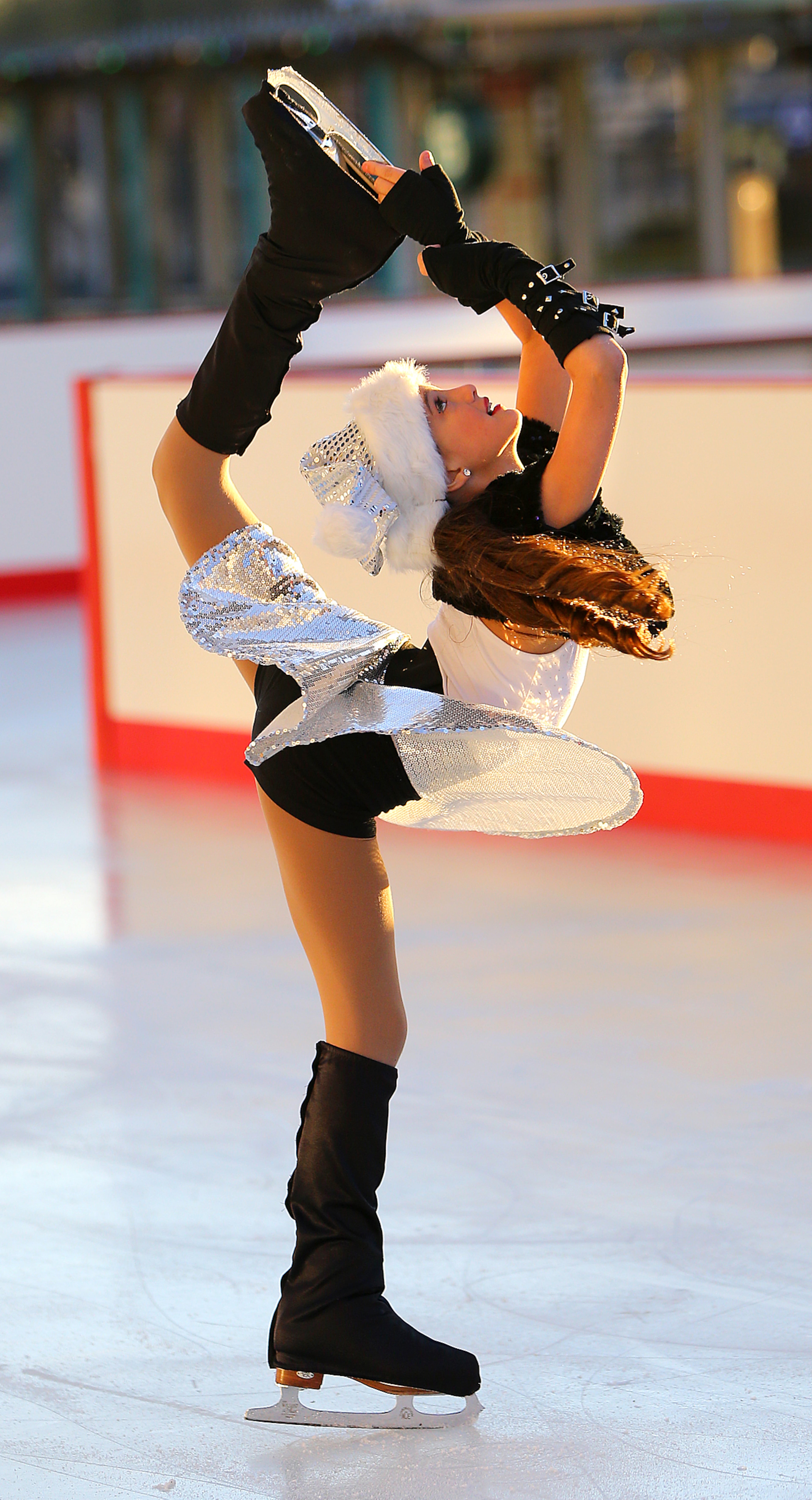Madeline Freeman, 9, from the Atlanta Figure Skating Club, performs to the sounds of "Rocking Around the Christmas Tree" at Skate Atlantic Station.