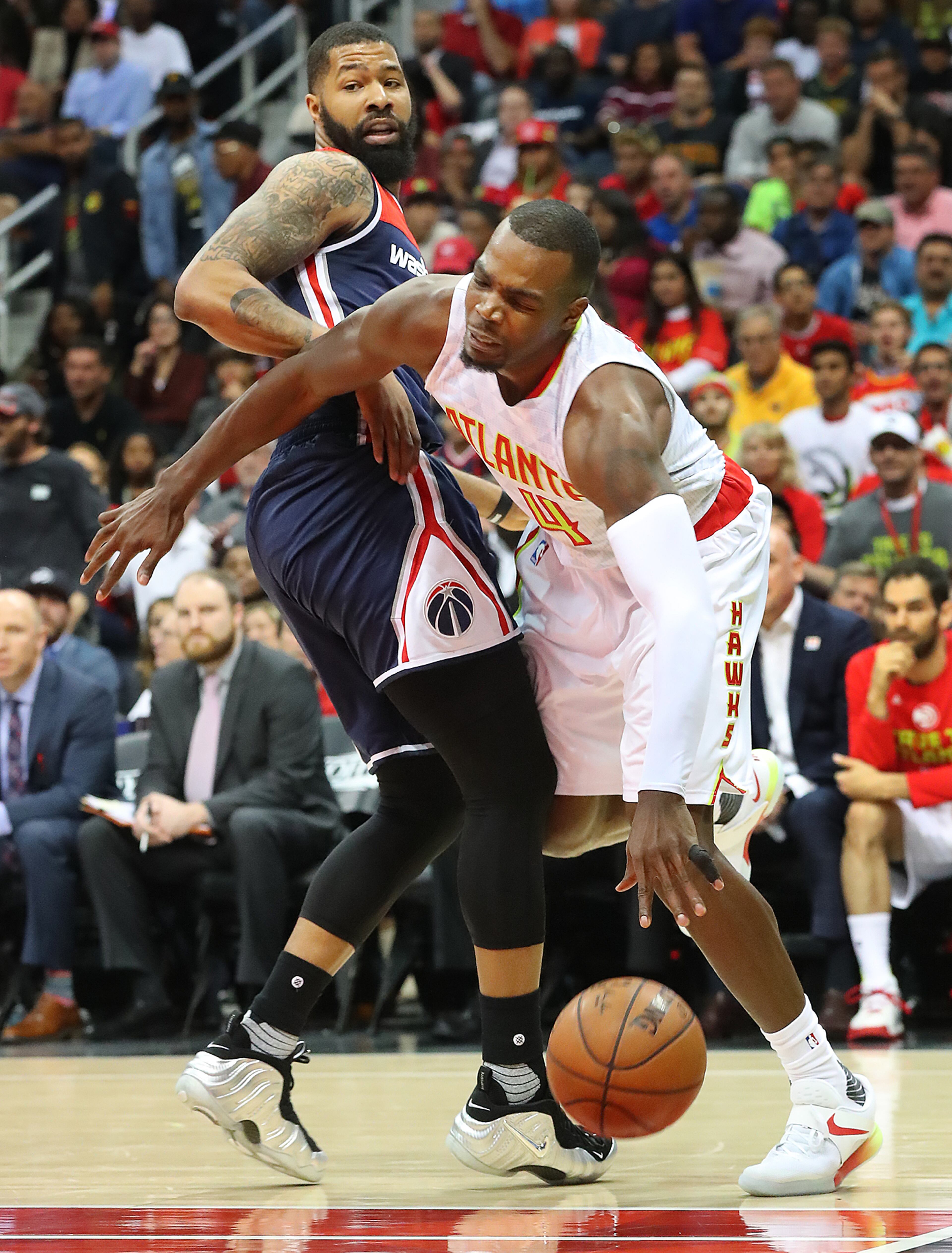 Paul Millsap is fouled by Washington's Markieff Morris in game 4 of a first-round NBA basketball playoff series on Monday, April 24, 2017, in Atlanta.