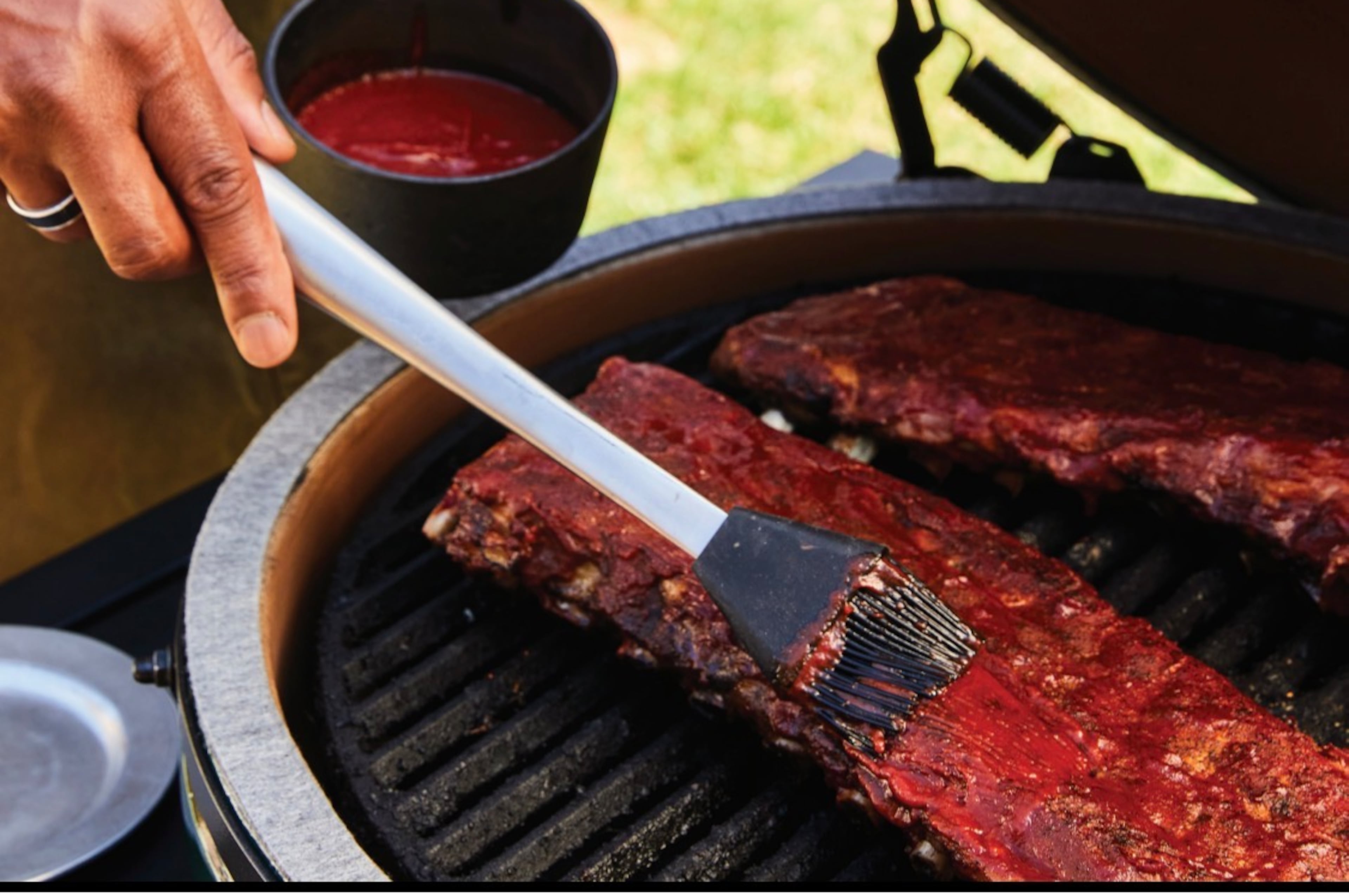 Chef David Rose sauces ribs.