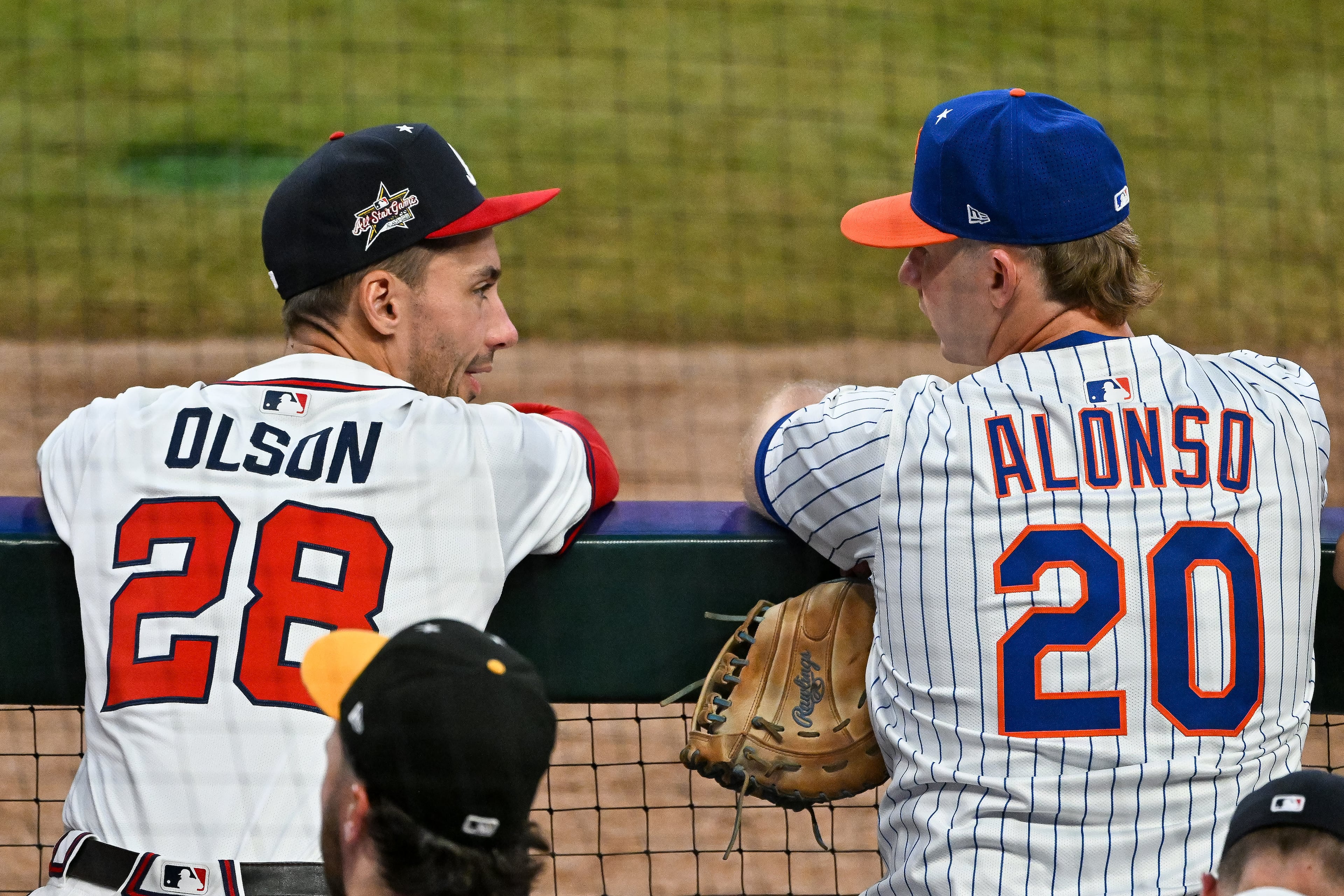 Atlanta Braves' Matt Olson talks to National League teammate Pete Alonso of the New York Mets during the MLB All-Star Game at Truist Park in Atlanta on Tuesday, July 15, 2025. (Hyosub Shin/AJC)