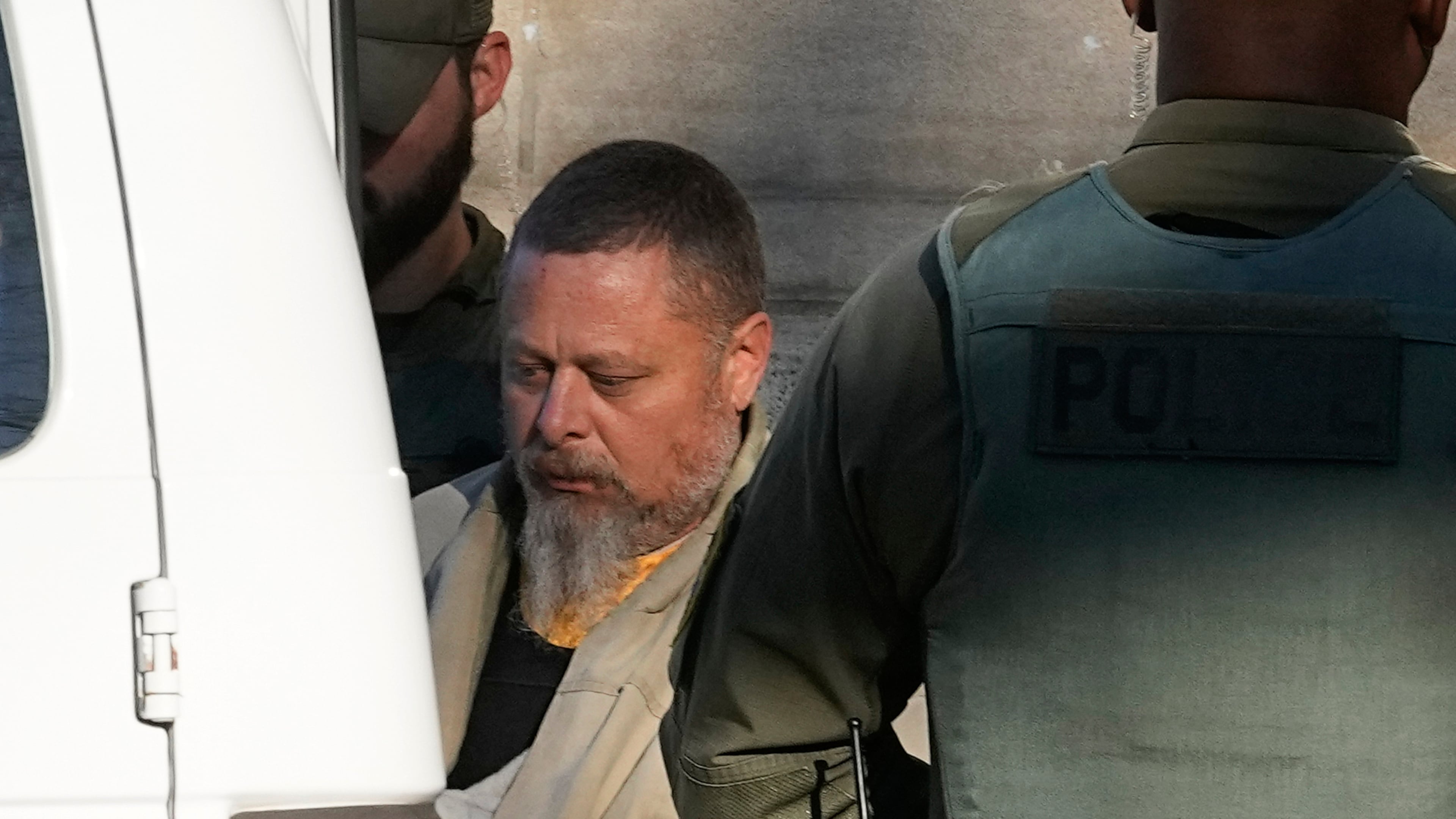 FILE - Officers escort Richard Allen out of the Carroll County courthouse following a hearing, Nov. 22, 2022, in Delphi, Ind. (AP Photo/Darron Cummings, File)