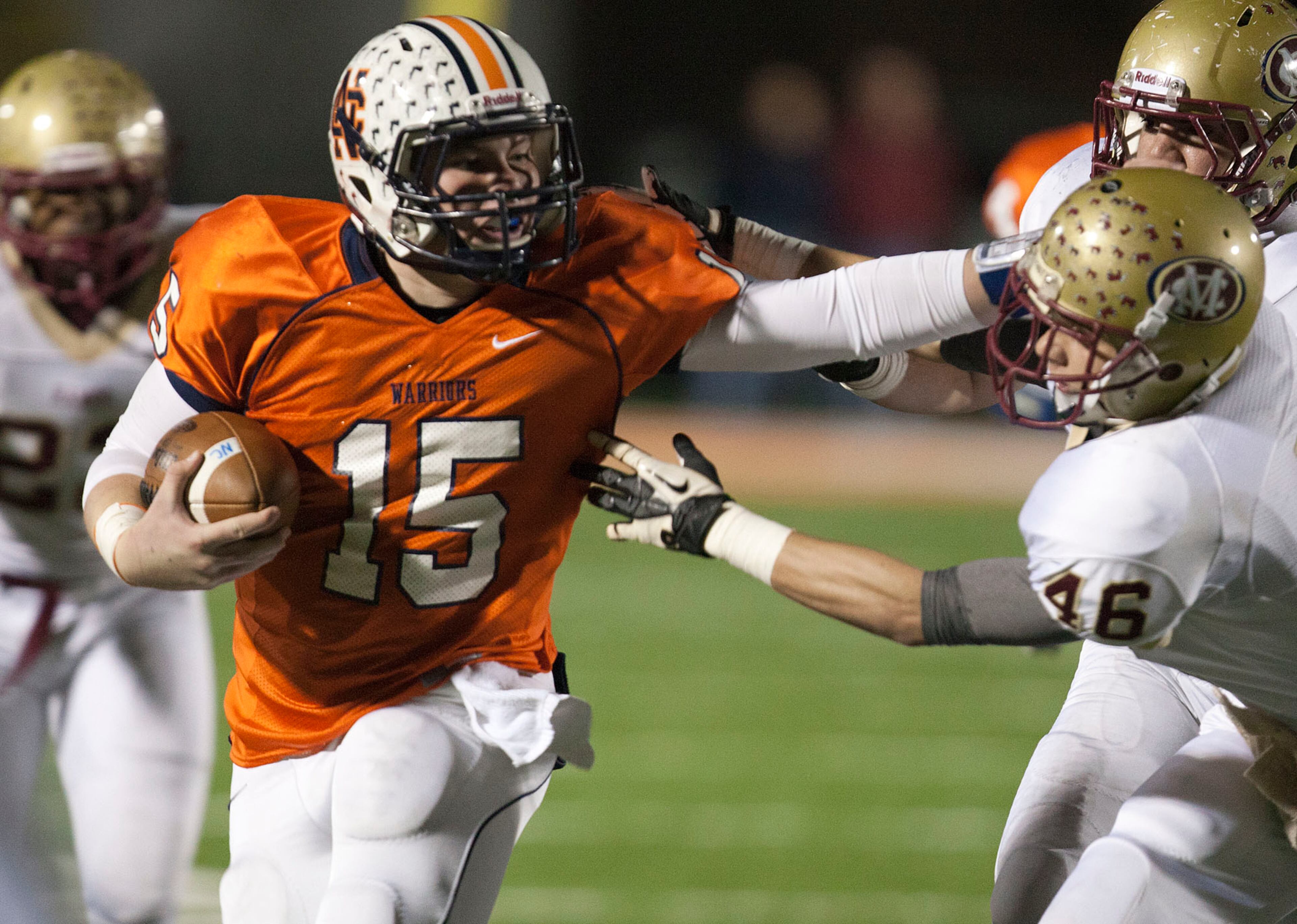 North Cobb quarterback Tyler Queen straight-arms Mill Creek's Zach Turner on his way to the goal line in the first half Friday Nov. 30, 2012. KELLY J. HUFF/SPECIAL