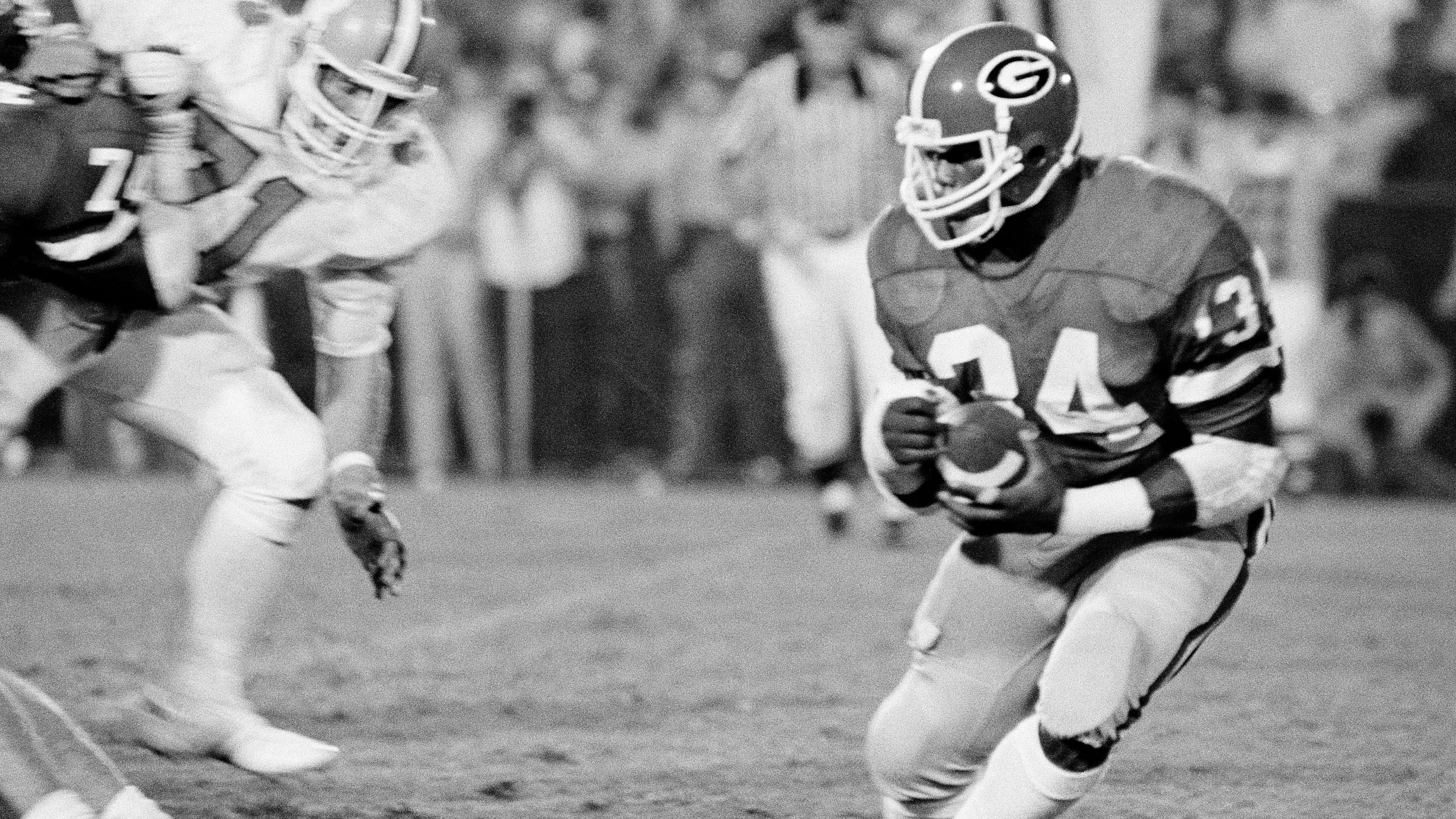 Clemson's Dan Benish (71) stalks Georgia's Herschel Walker in a 1982 game. (Associated Press)