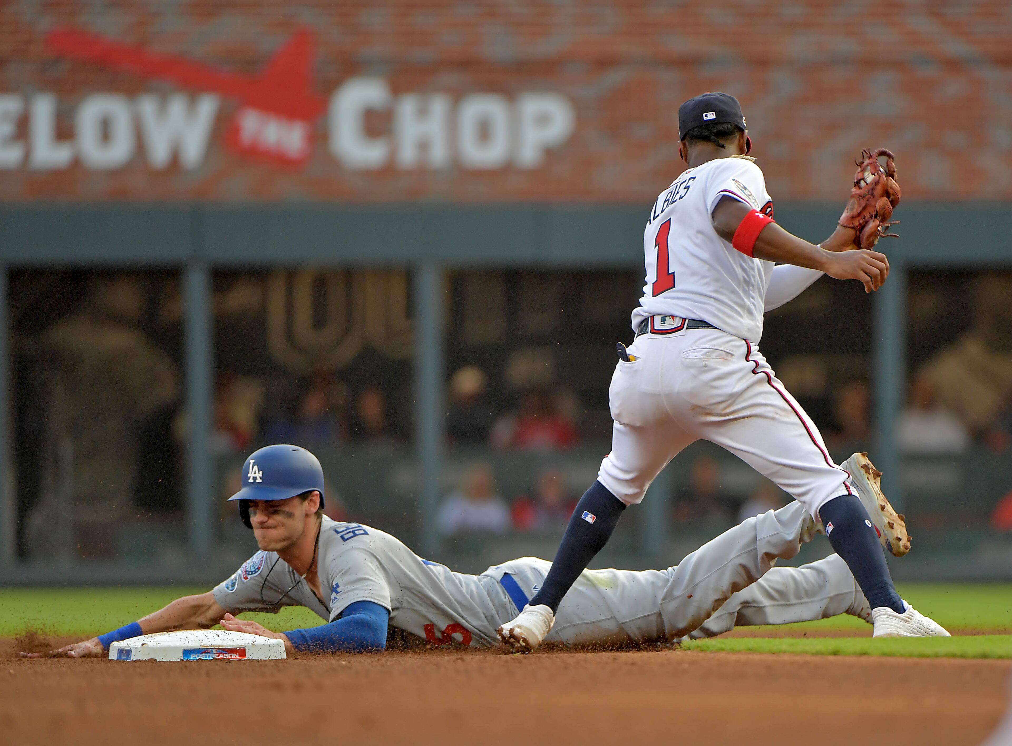 Cody Bellinger steals second base ahead of the tag by Ozzie Albies in the fourth inning. (Hyosub Shin/hshin@ajc.com)
