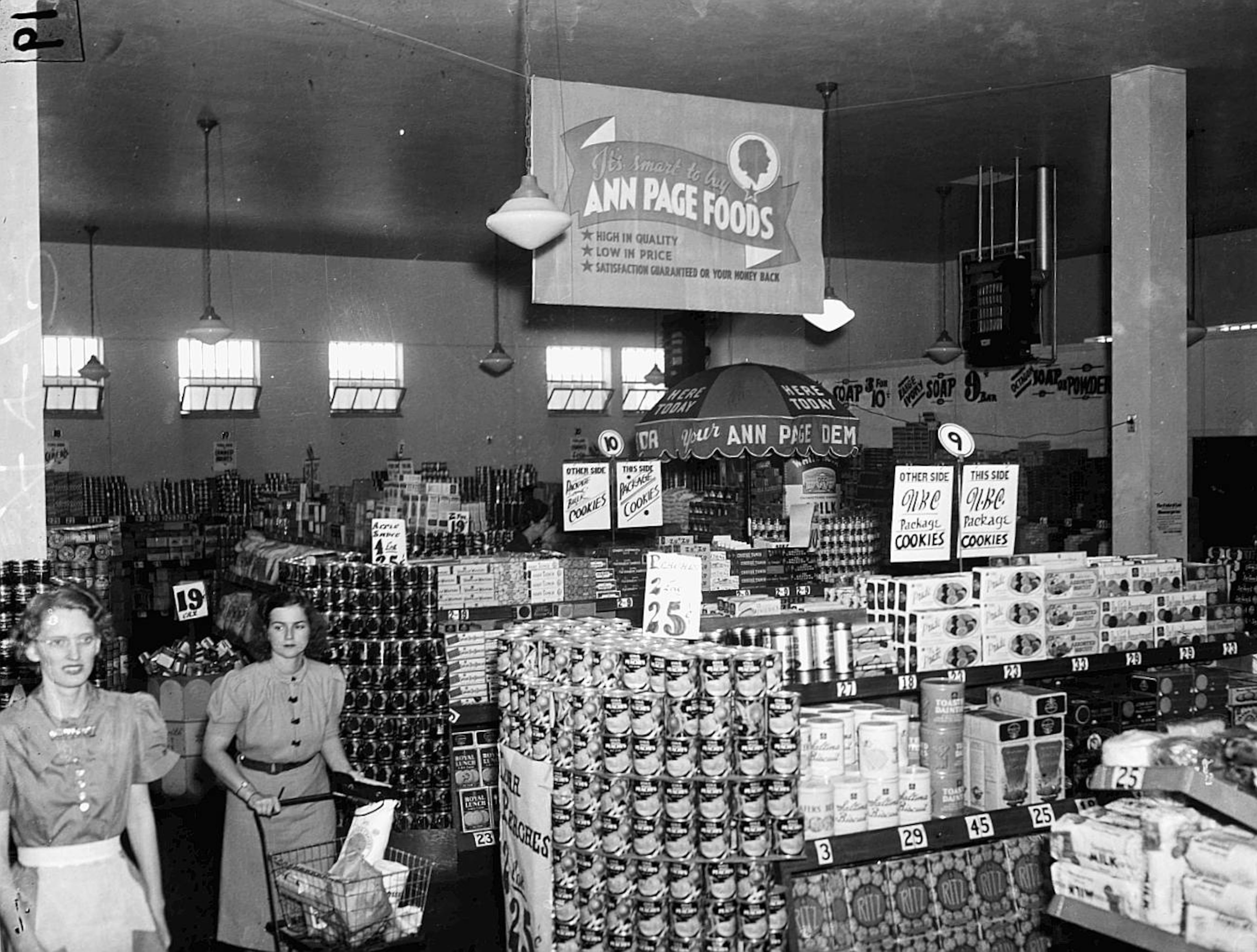 Shoppers pass a sign promoting A&P's Ann Page store brand items in this 1940s photo taken at an Atlanta area store.