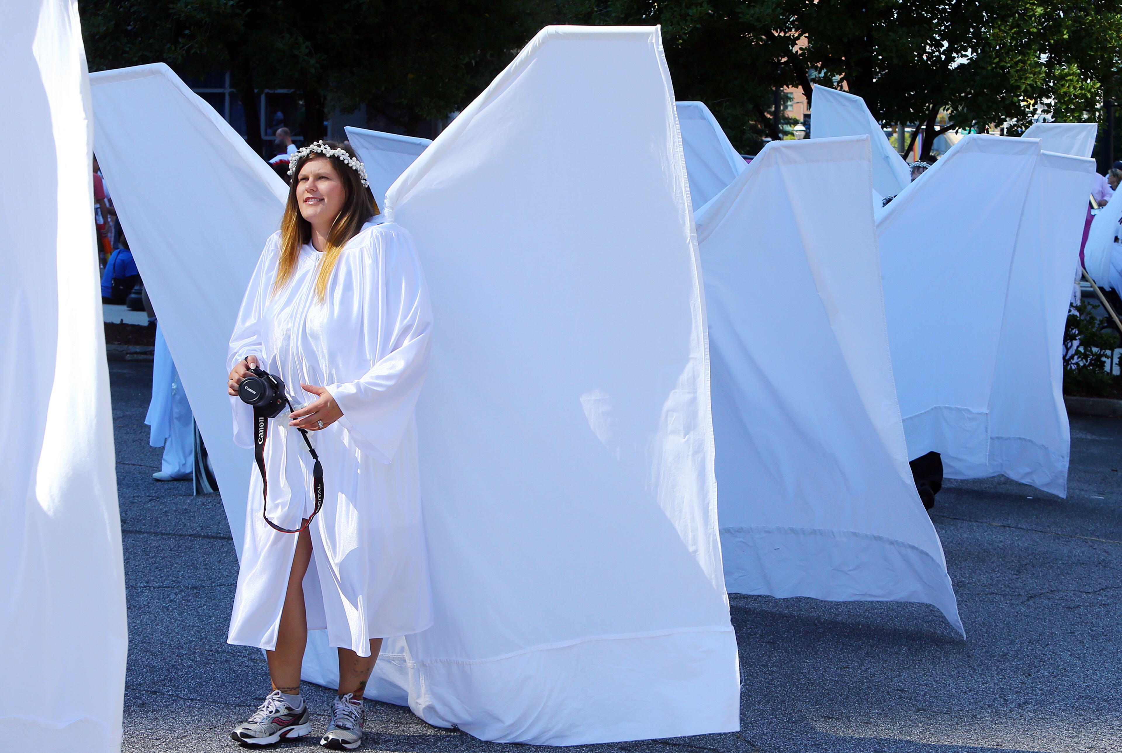 Michelle Bryan and other members of Angel Action Atlanta wear their wings lining up to participant in the Pride Parade on Sunday, Oct. 13, 2013, in Atlanta. CURTIS COMPTON /staff CCOMPTON@AJC.COM