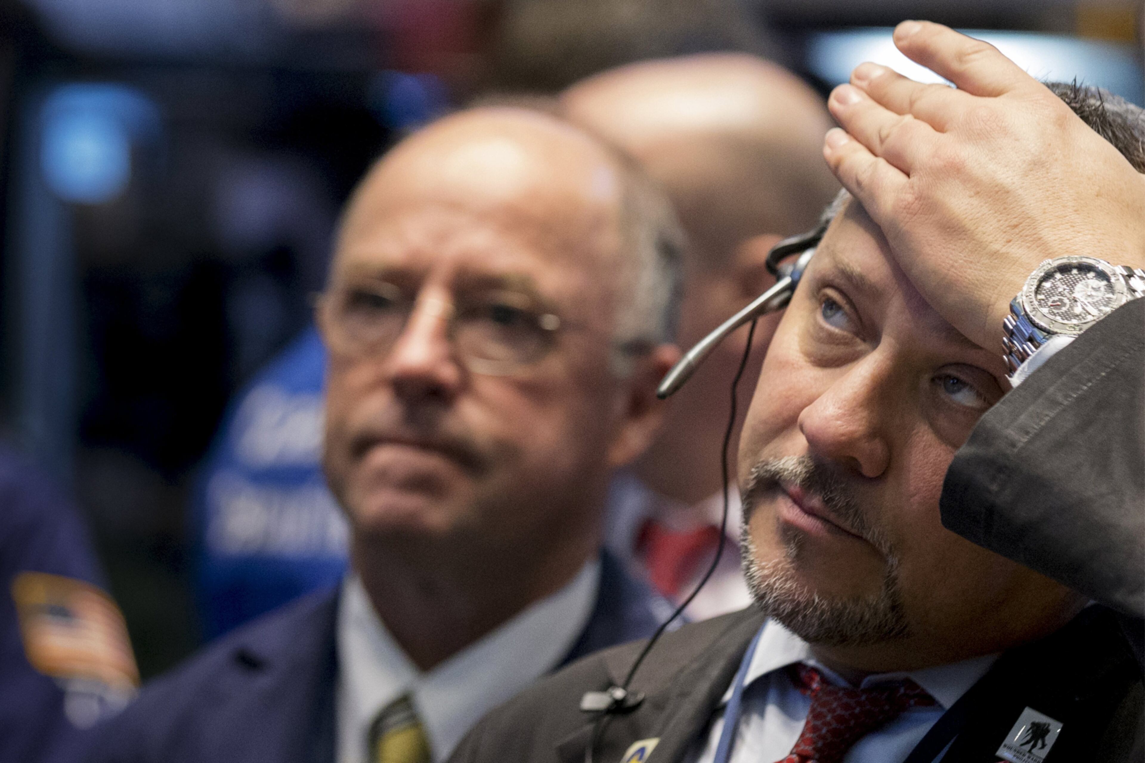 WORKING FOR THE MONEY--Traders work on the floor of the New York Stock Exchange March 24, 2015. REUTERS/Brendan McDermid