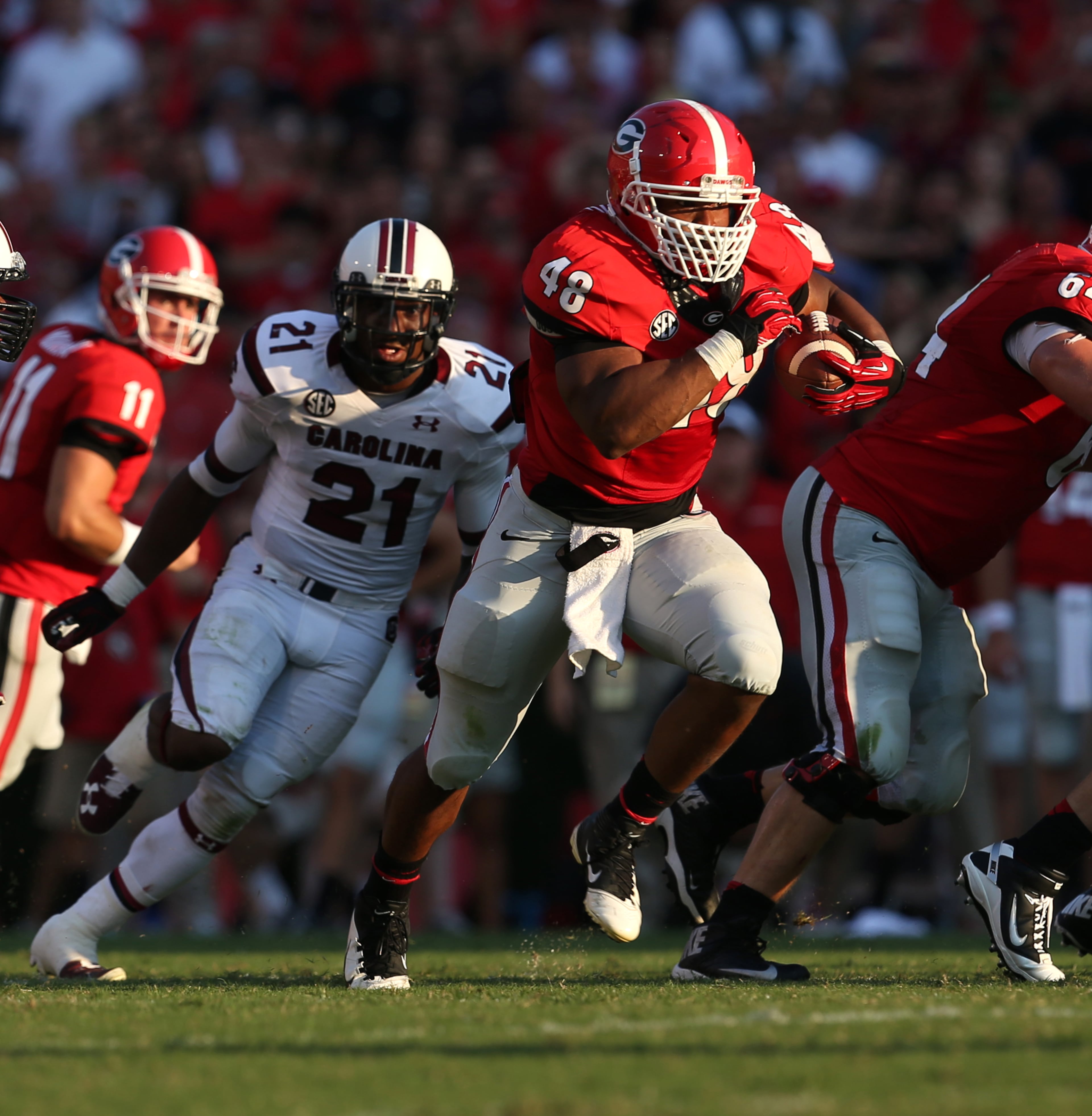 University of Georgia fullback Quayvon Hicks (48) runs for 15 yards in the third quarter during Georgia's win over South Carolina Saturday afternoon in Athens, Ga., September 7, 2013. JASON GETZ / JGETZ@AJC.COM