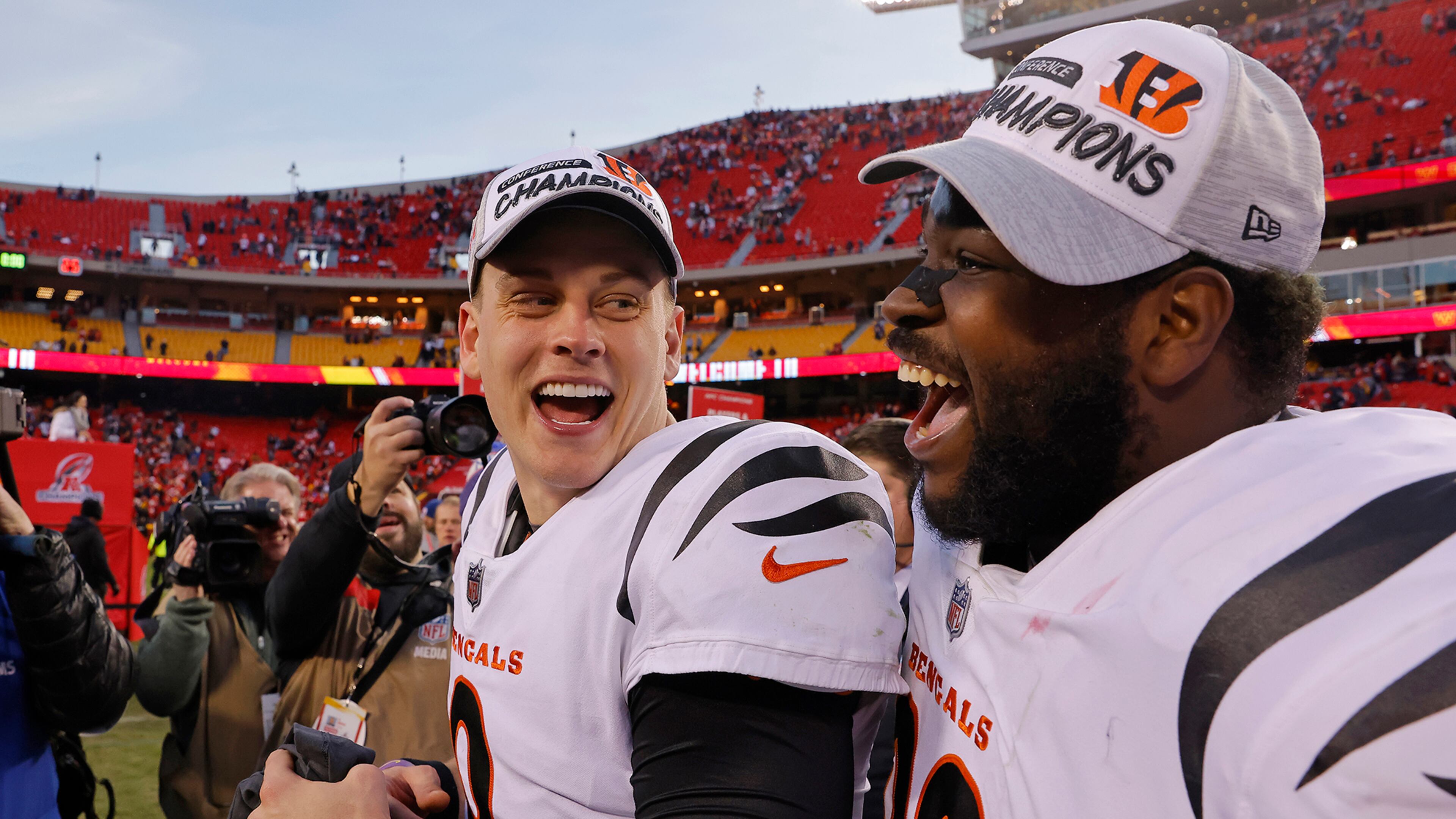 Quarterback Joe Burrow (9) of the Cincinnati Bengals and defensive tackle Tyler Shelvin (99) celebrate following the Bengals overtime win against the Kansas City Chiefs in the AFC Championship Game at Arrowhead Stadium on January 30, 2022, in Kansas City, Missouri. (David Eulitt/Getty Images/TNS)
