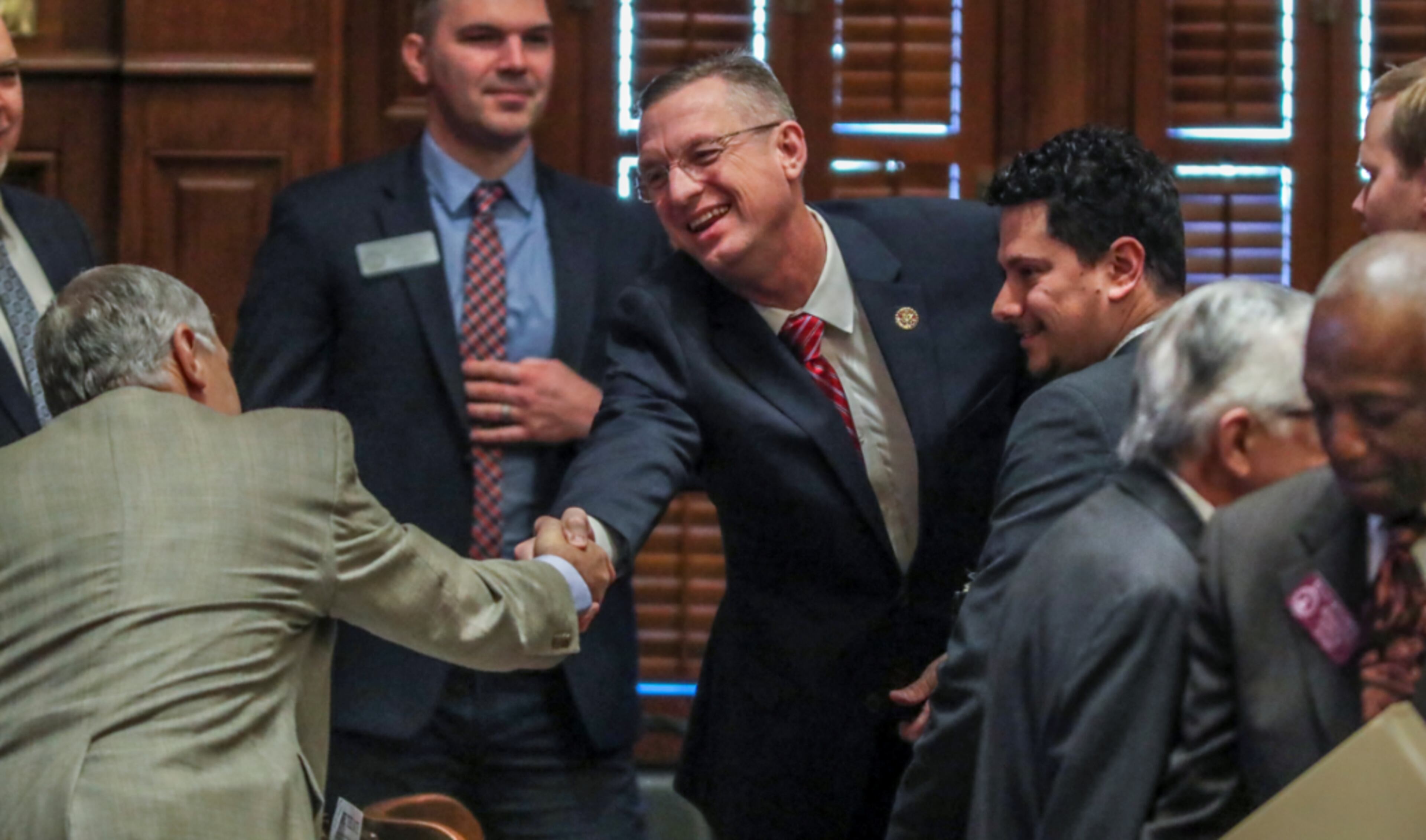 January 28, 2020 Atlanta: U.S. Rep. Doug Collins (center) shakes hands with members of the House before he addressed the Georgia House on Tuesday, Jan. 28, 2020 as its Chaplin of the day. This coming just hours after news broke that Collins is preparing to challenge U.S. Sen. Kelly Loeffler, and avoided any mention of seeking a higher office. In his sermon and closing prayer, Collins honored Rep. Jay Powell, the House Rules Committee chairman who died in November and who Collins described as a mentor. Speaker David Ralston signaled his support of the soon-to-be senate candidate, stopping short of an explicit endorsement. Collins and Ralston have a strong relationship dating back to their time as state house colleagues; Collins voted for Ralston’s speakership while deployed in Iraq. “He is my friend. He has stood by me when few would,†Ralston said.â€And I don’t forget things like that.†JOHN SPINK/JSPINK@AJC.COM