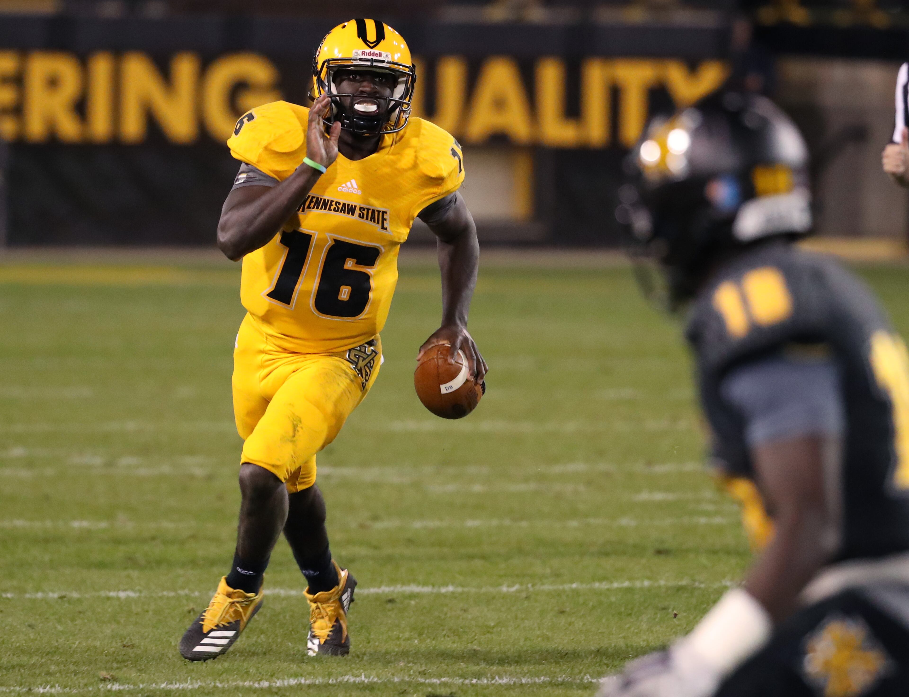 March 22, 2019 - Kennesaw, Ga: Kennesaw State Owls quarterback Jonathan Murphy (16) runs for yards during the KSU spring football game at Fifth Third Bank Stadium Friday, March 22, 2019 in Kennesaw, Ga.. (JASON GETZ/SPECIAL TO THE AJC)