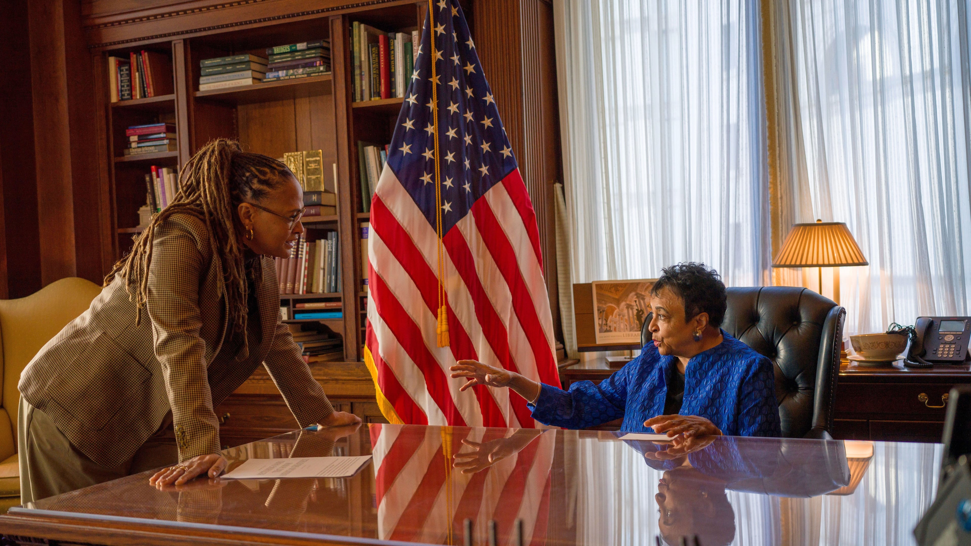 This image released by Netflix shows director Ava DuVernay, left, with 14th librarian of Congress, Carla Hayden, during the filming of the documentary “14th" about the 14th amendment, which gave liberty and rights to formerly enslaved people following the Civil War. (Paul Garnes/Netflix via AP)