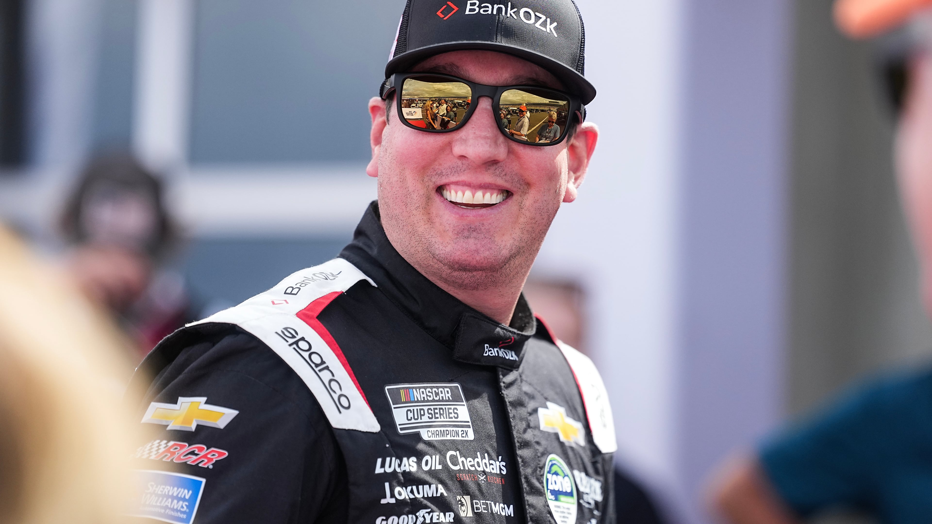 FILE - Kyle Busch smiles prior to a NASCAR Cup Series auto race at Charlotte Motor Speedway, Sunday, Oct. 5, 2025, in Concord, N.C. (AP Photo/Matt Kelley, File)