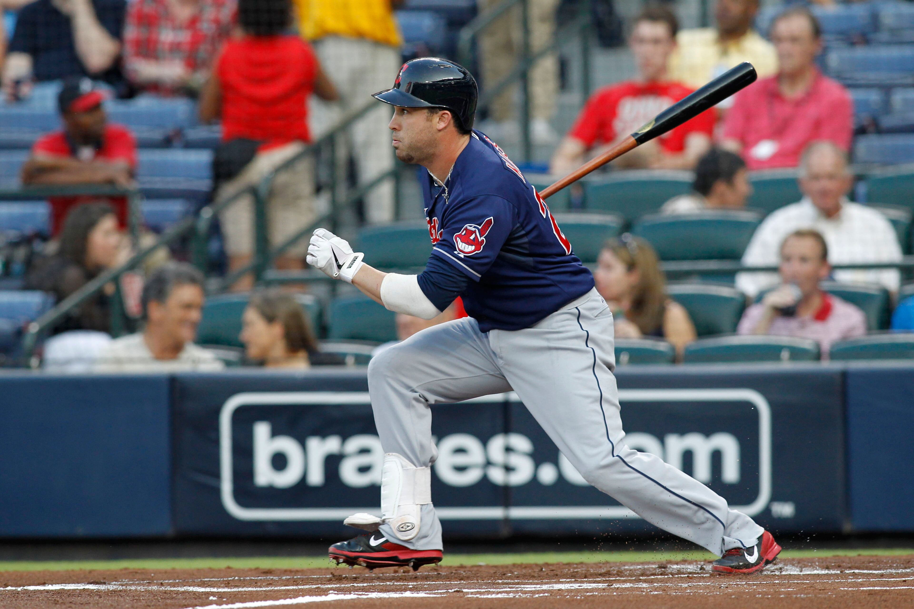 Cleveland Indians second baseman Jason Kipnis (22) hits a single against the Atlanta Braves in the first inning at Turner Field. Brett Davis-USA TODAY Sports