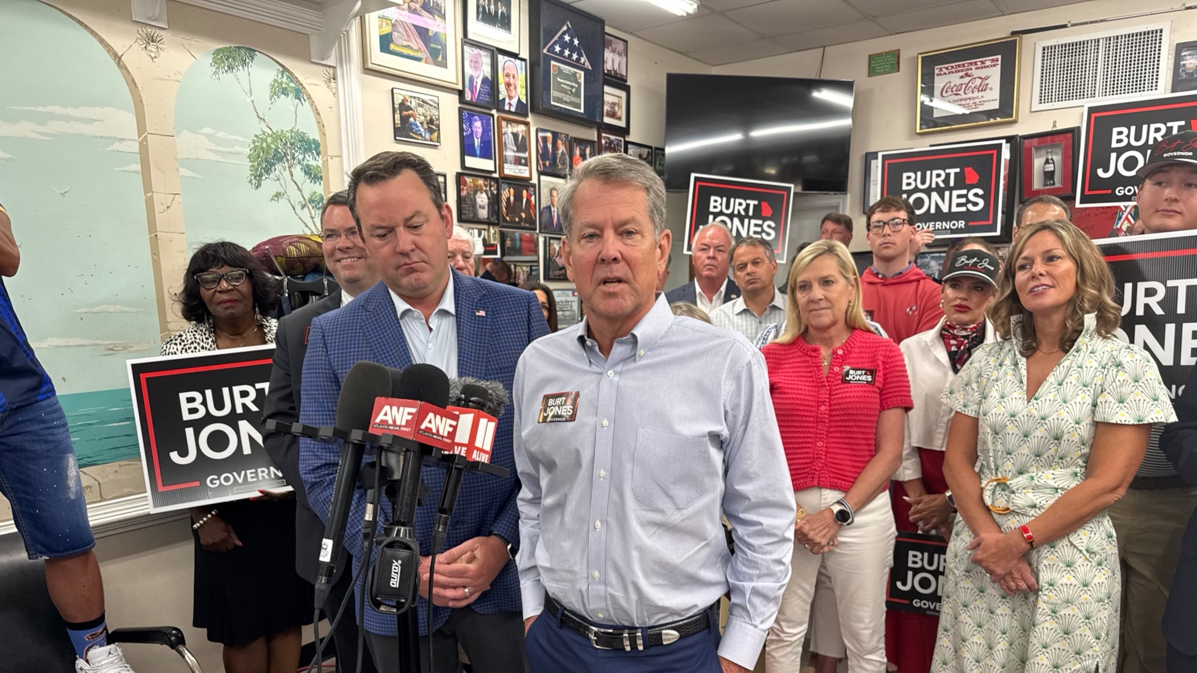 Gov. Brian Kemp (right) campaigns with Lt. Gov. Burt Jones shortly after endorsing him in the Republican primary for governor. (Greg Bluestein/AJC)