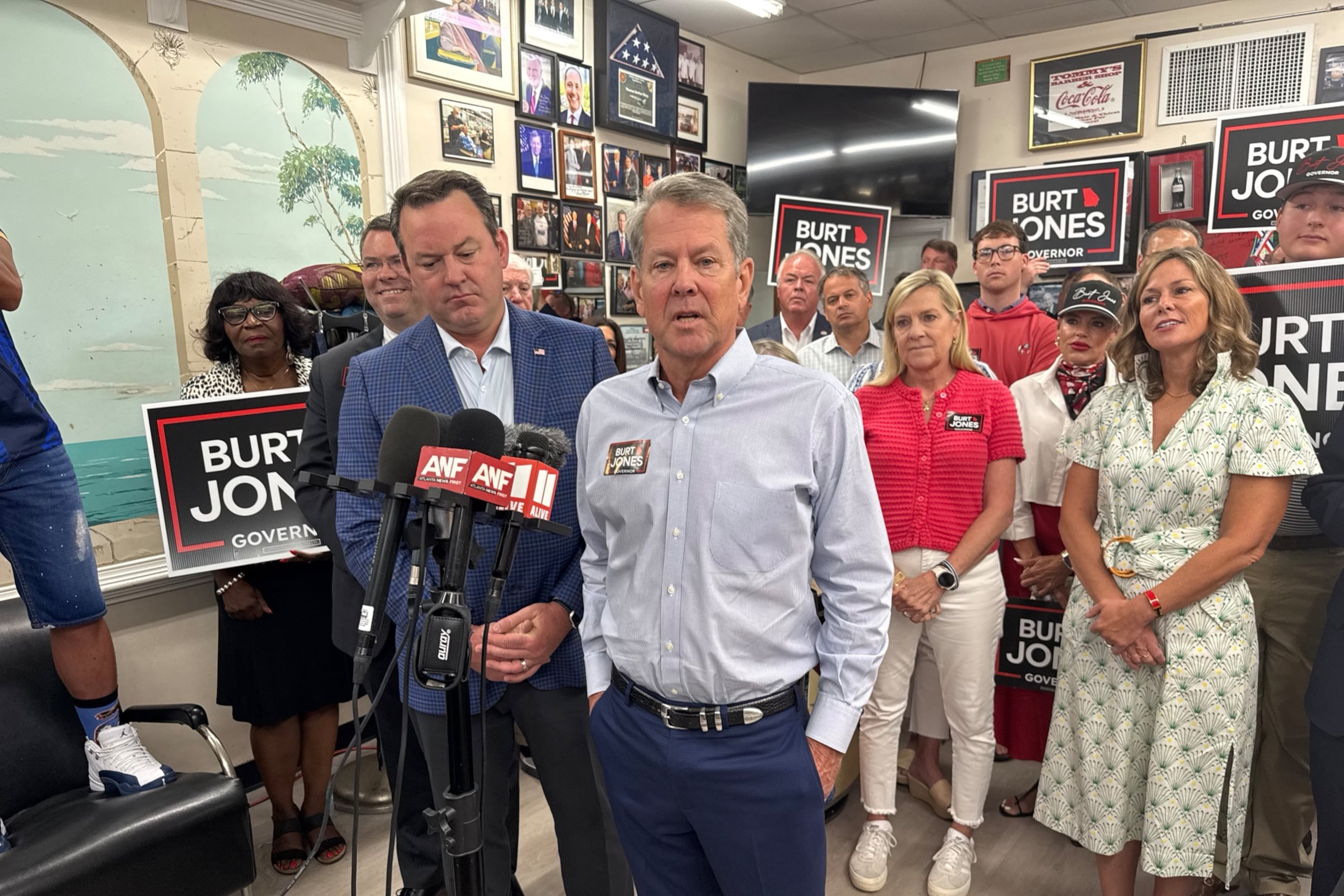 Gov. Brian Kemp (right) campaigns with Lt. Gov. Burt Jones shortly after endorsing him in the Republican primary for governor. (Greg Bluestein/AJC)