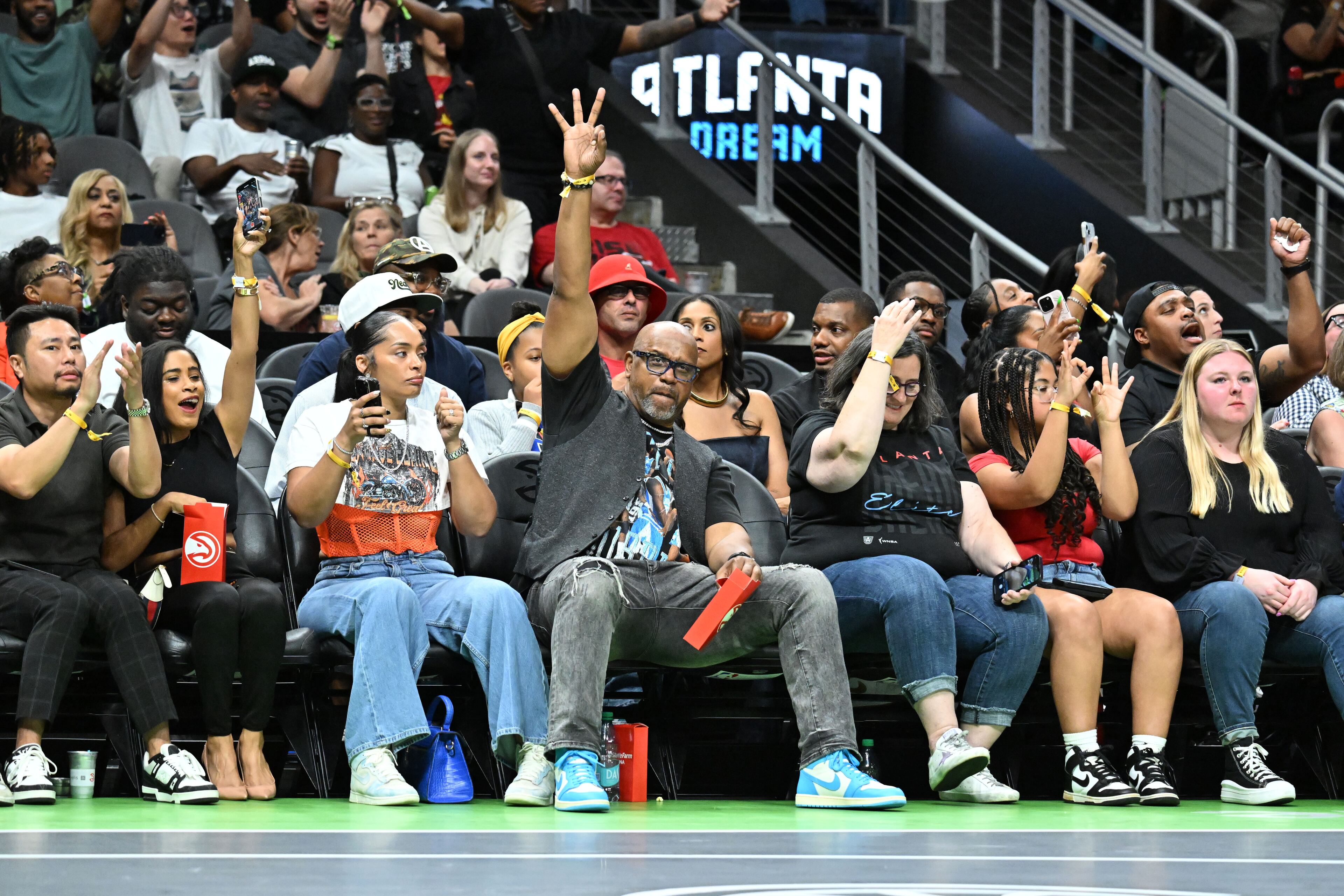 Fans cheer during the first half in Atlanta Dream’s home opener at State Farm Arena, Thursday, May 22, 2025, in Atlanta. (Hyosub Shin / AJC)