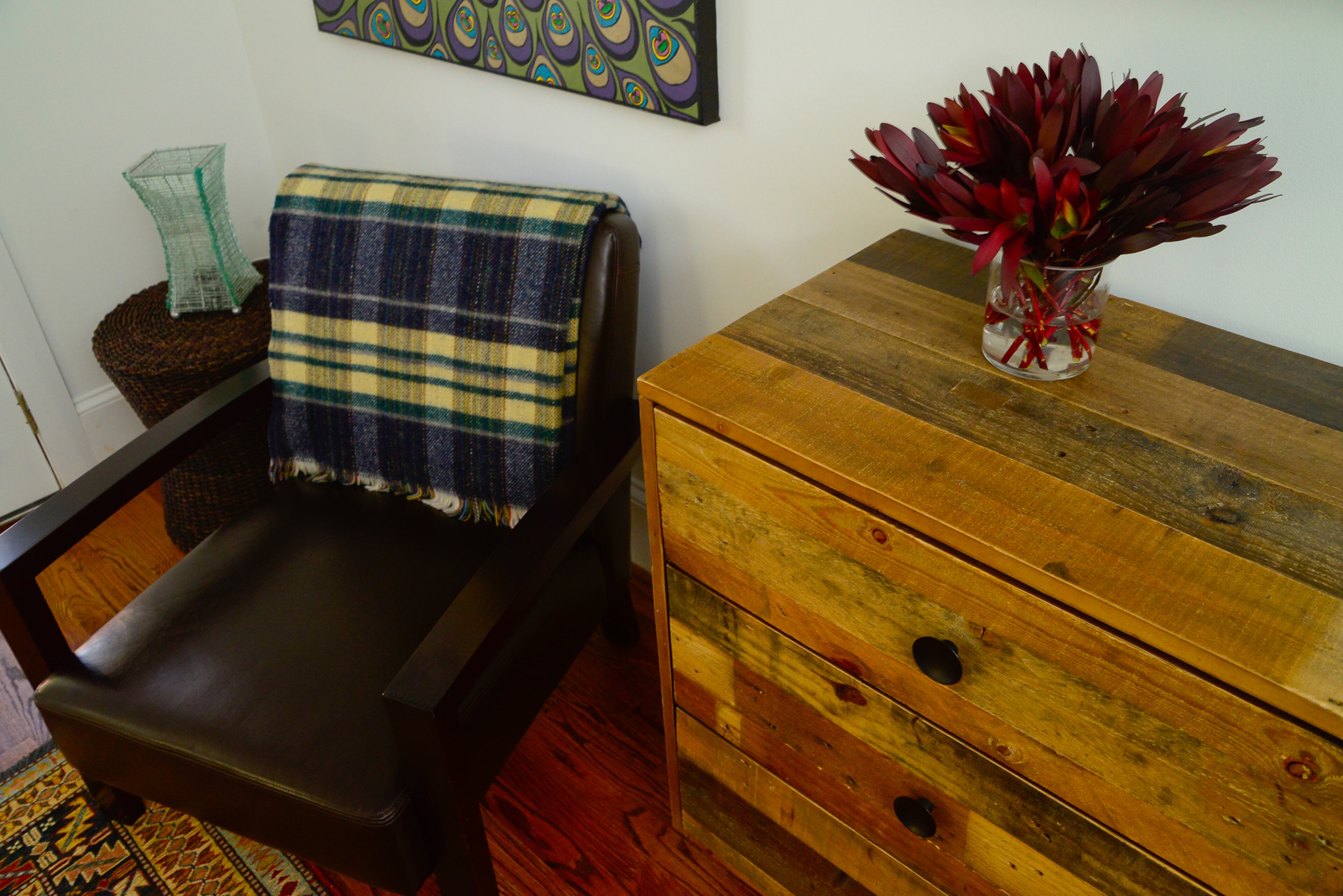 A reclaimed wood dresser from West Elm is part of the decor in the master bedroom and reflects the Swedish farmhouse feel that homeowner Eileen Ansley wanted in her East Atlanta bungalow.