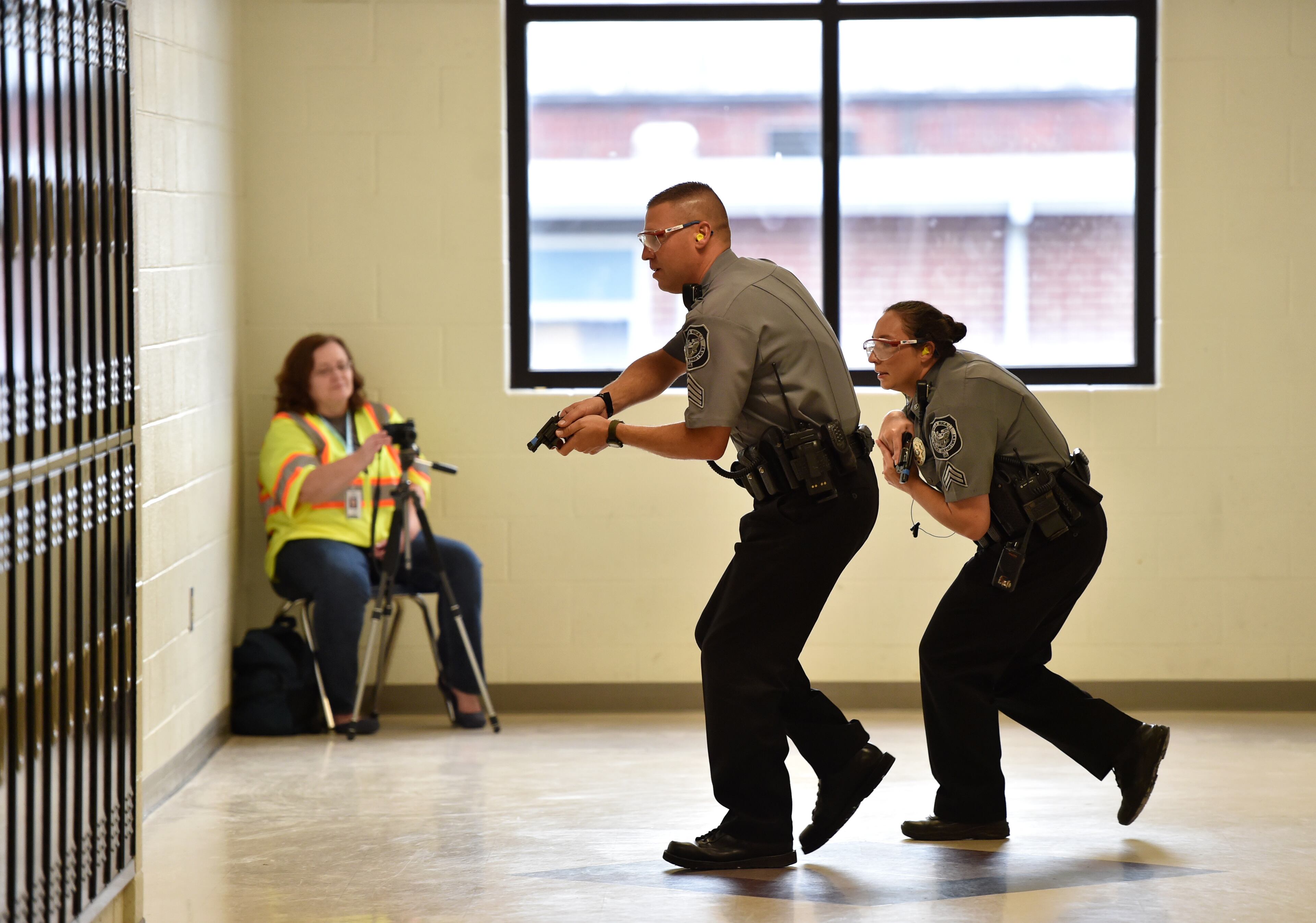 October 9, 2015 Villa Rica, GA: Villa Rica Police Officers secure the school during an active shooter drill at Villa Rica High School Friday October 9, 2015. Carroll County School, Villa Rica Police Department, Carroll County Public Safety, Carroll County Sheriffs Office, Georgia State Patrol and Tanner Healthcare took part in the drill. School was not in session, teachers and administrators played the part of students during the drill. A shooter played by a law enforcement officer entered the school and began shooting. The drill was designed to test the response of school officials, police and EMT. "Patients" were transported to the hospital via ambulances and helicopter. Officials said drills are important tools to help reinforce disaster preparedness and give the faculty the skills they need to respond in a real-world scenario. BRANT SANDERLIN/BSANDERLIN@AJC.COM