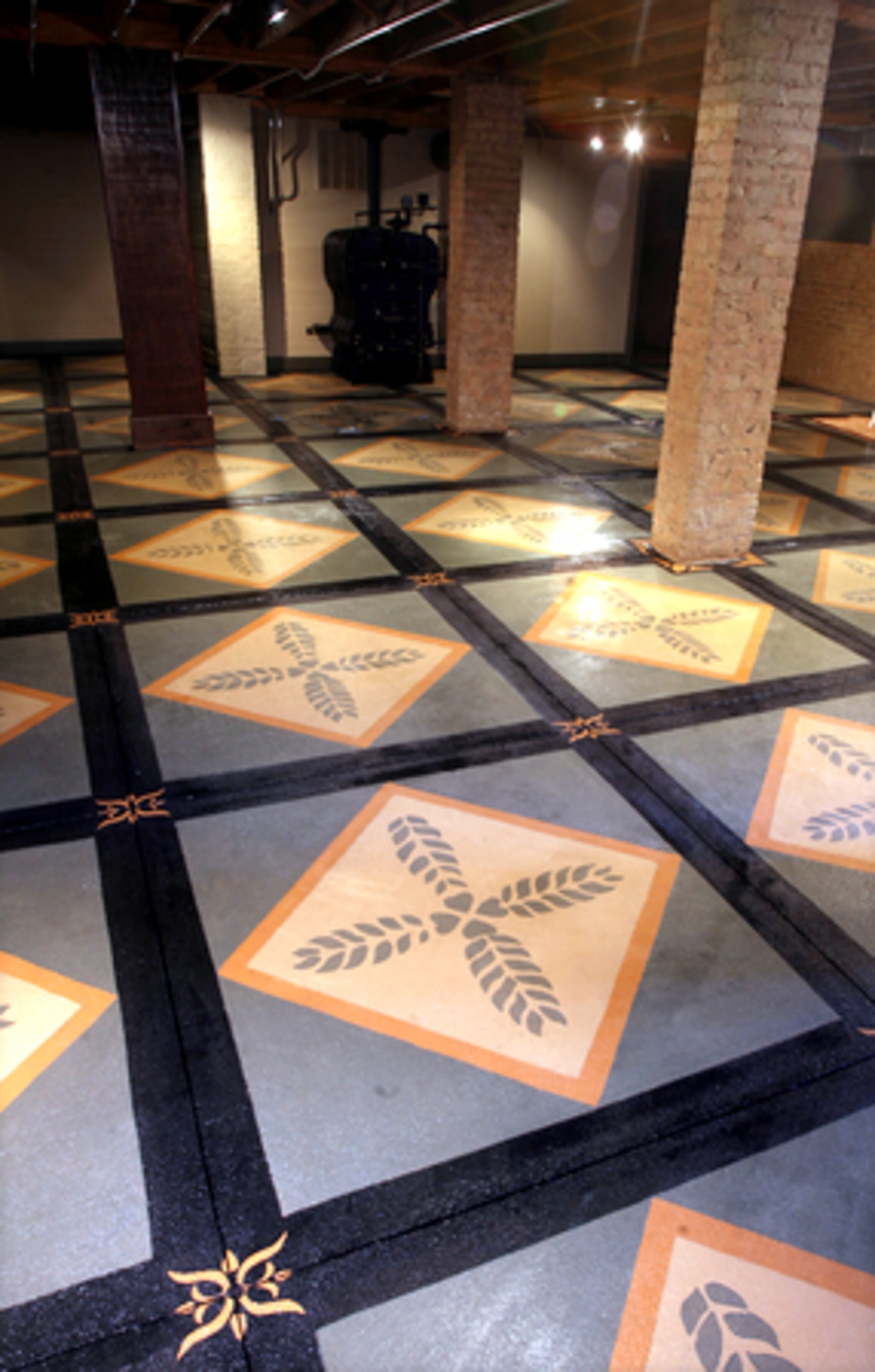 The couple has done everything, from finding new old stained glass to putting in new plaster, stripping the walls and trim and sanding the floors. Here is the basement floor with an impressive design on the concrete squares.