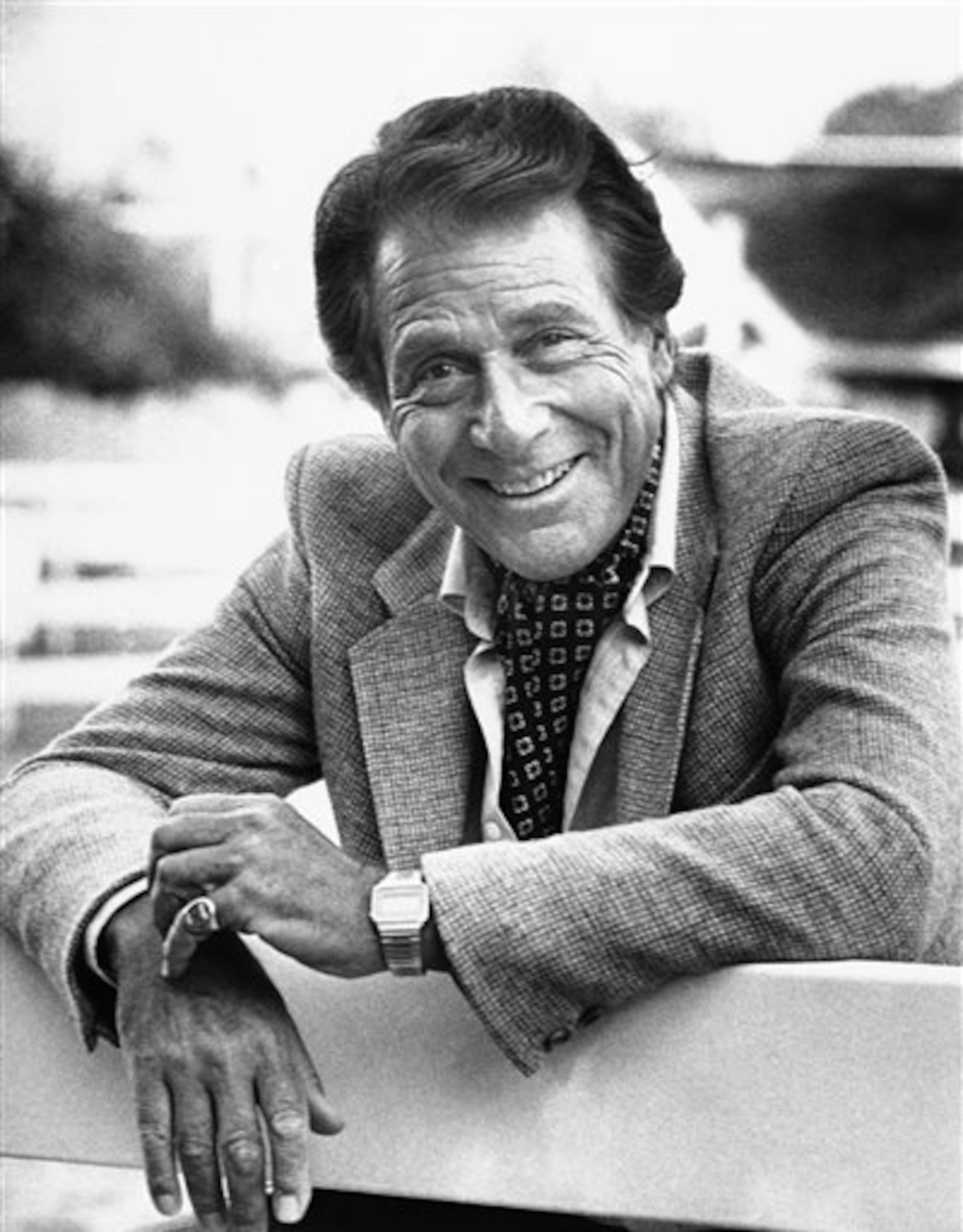 FILE - Veteran actor Efrem Zimbalist, Jr., known for his starring roles in "77 Sunset Strip" and "The FBI," stands outside his home, in this Feb. 16, 1982 file photo taken in Los Angeles, Calif. Zimbalist, the son of famous musicians who gained television stardom in the 1950s-60s hit "77 Sunset Strip" and later "The FBI," died Friday at his ranch in Solvang, Calif., at age 95. (AP Photo/Wally Fong, File)