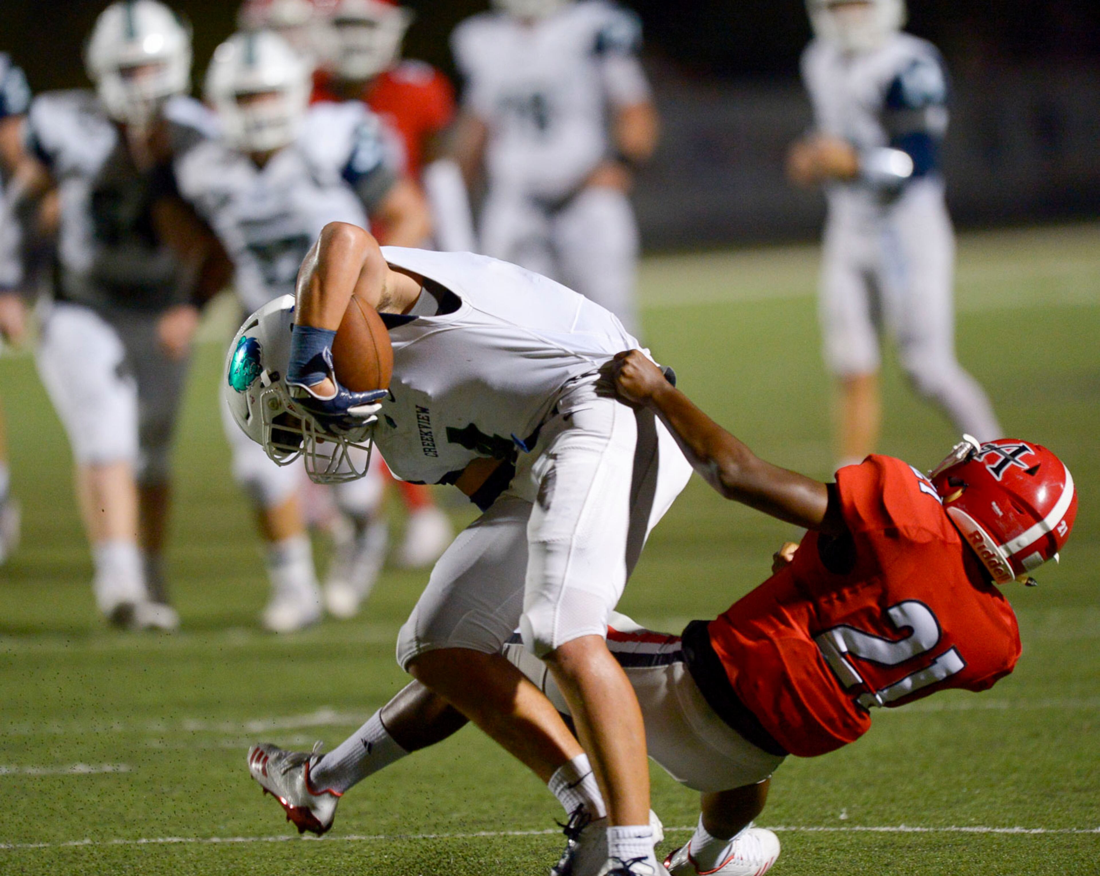 Allatoona cornerback Kole Bratton (21) holds onto Creekview running back Hayden Thompson (4) as he runs the ball late in the second half of their game at Allatoona High Friday, September 6, 2019. PHOTO/Daniel Varnado