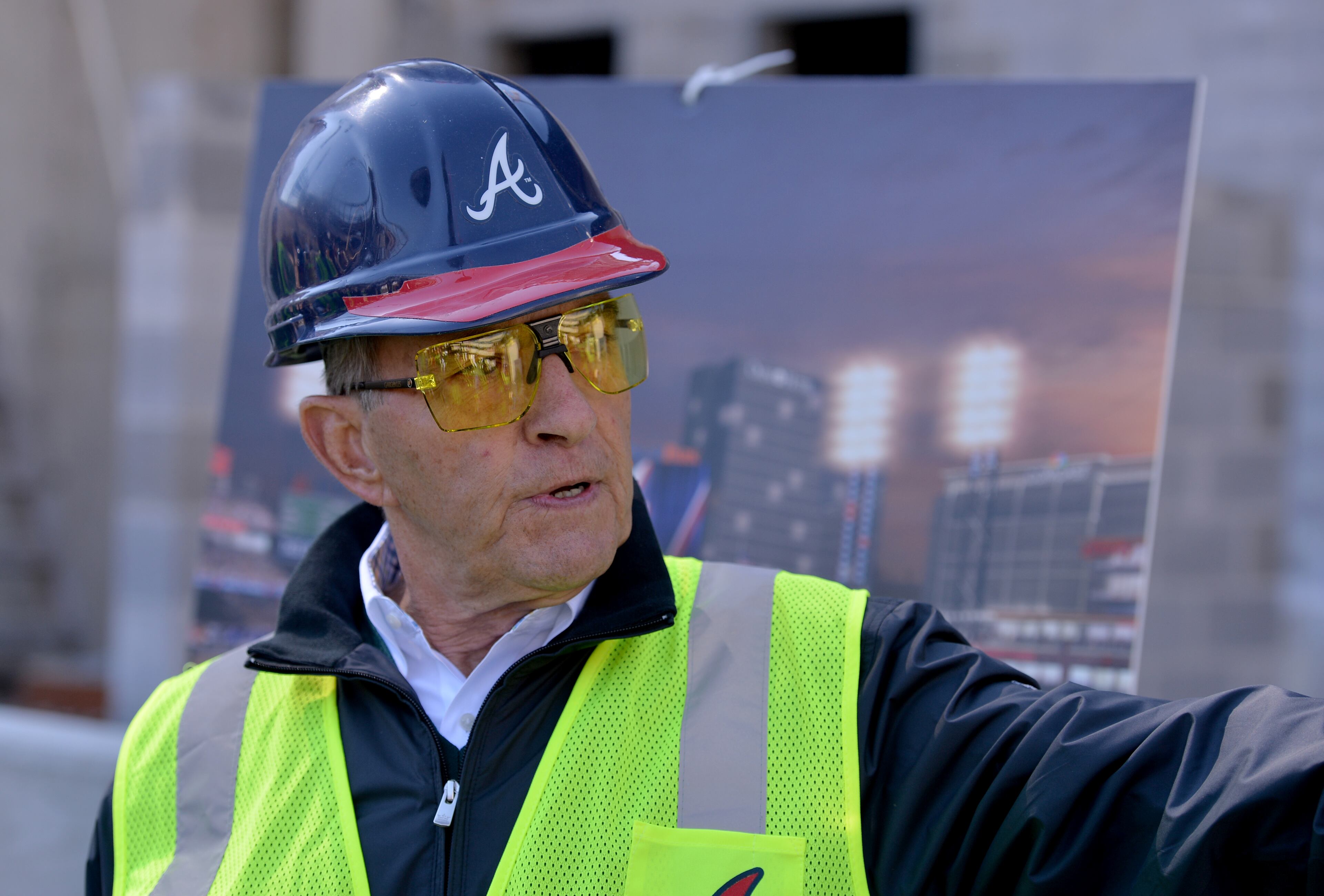 Braves Vice Chairman John Schuerholz explains the uniqueness of the outfield wall. BRANT SANDERLIN/BSANDERLIN@AJC.COM