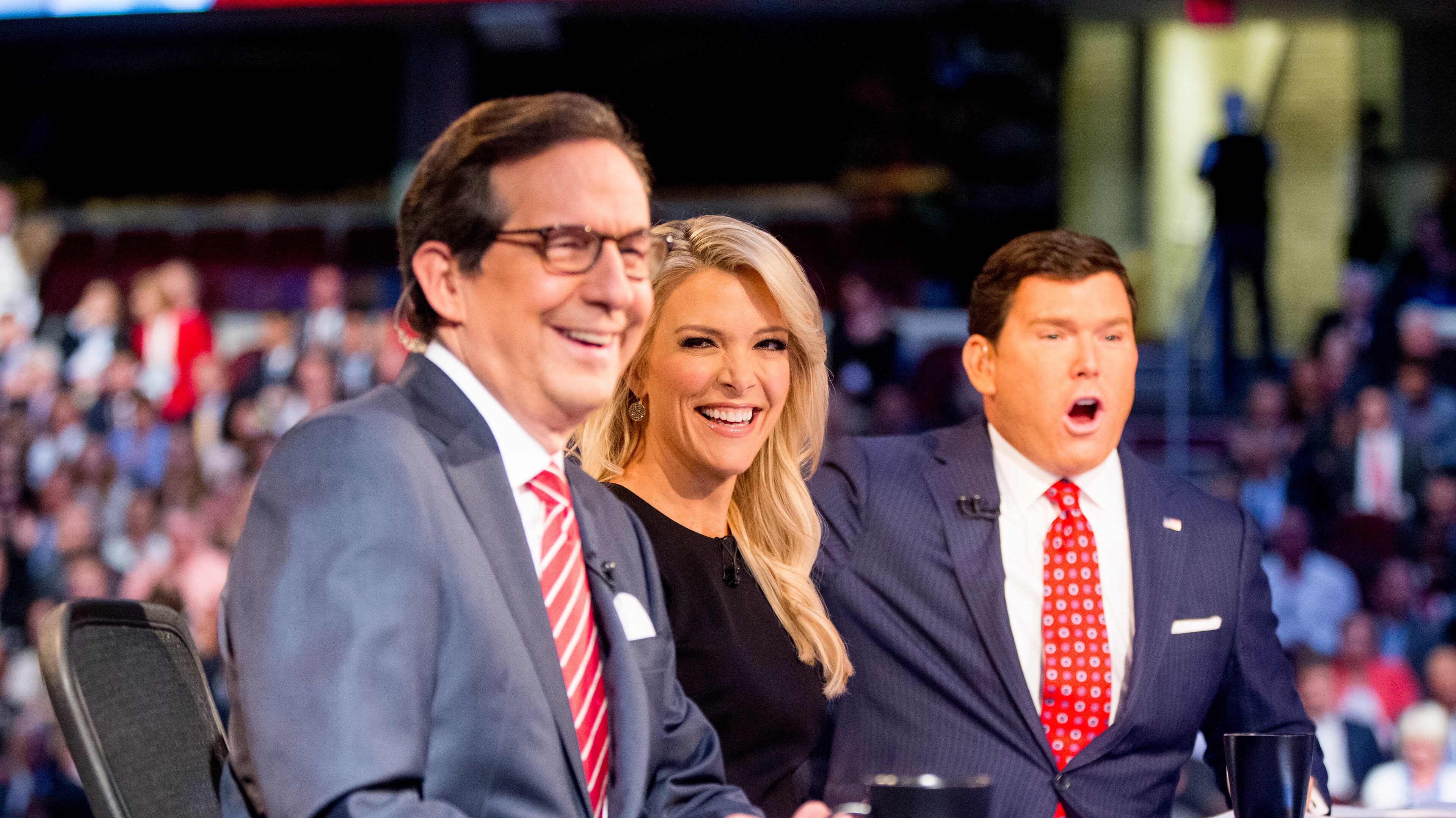 Fox News moderators from left, Chris Wallace, Megyn Kelly and Bret Baier speak to the camera before the first GOP presidential debate in August 2015, held in Cleveland. AP/Andrew Harnik