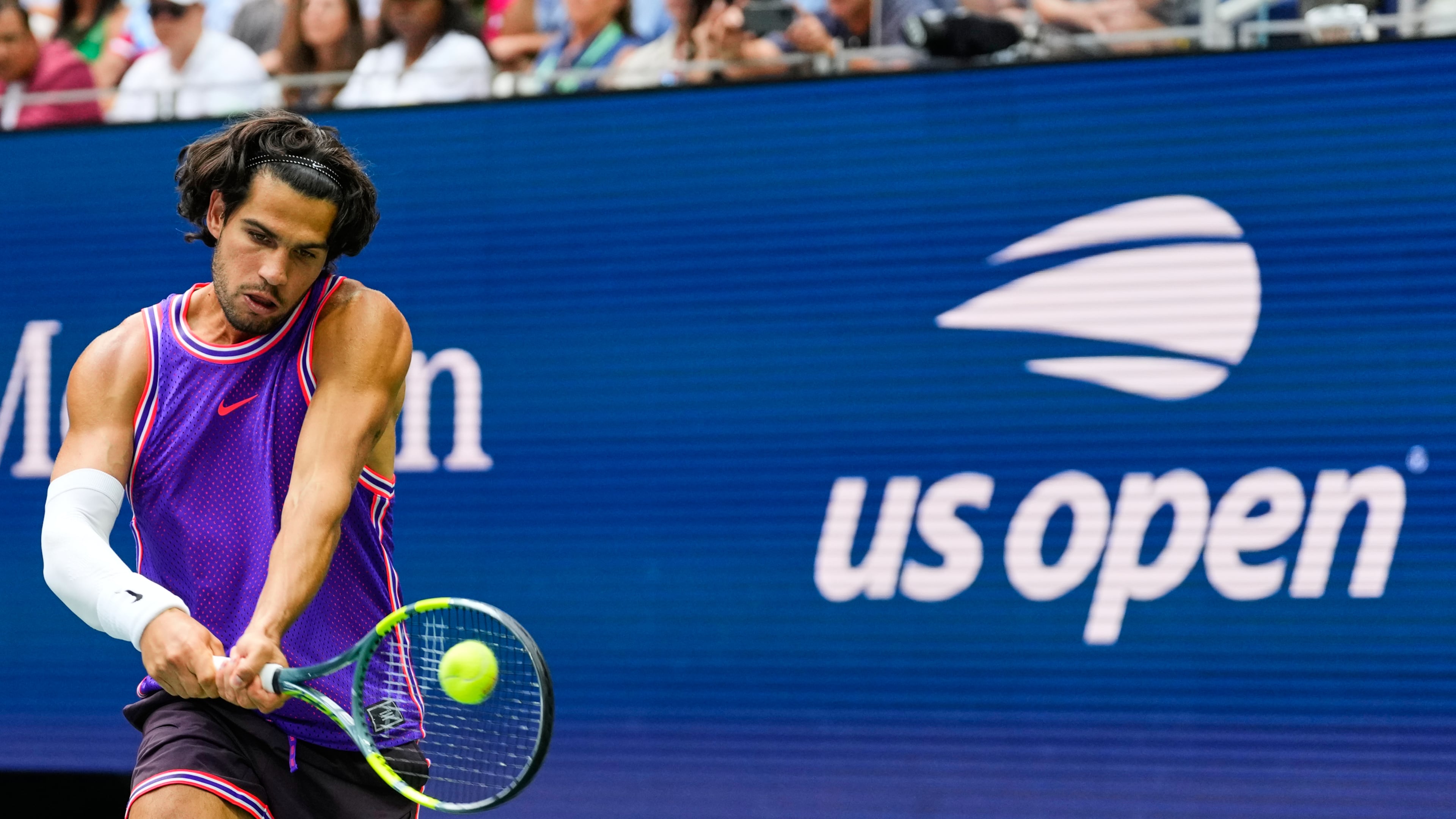 Carlos Alcaraz, of Spain, returns the ball during a mixed doubles match at the U.S. Open tennis championships, Tuesday, Aug. 25, 2026, in New York. (AP Photo/Yuki Iwamura)